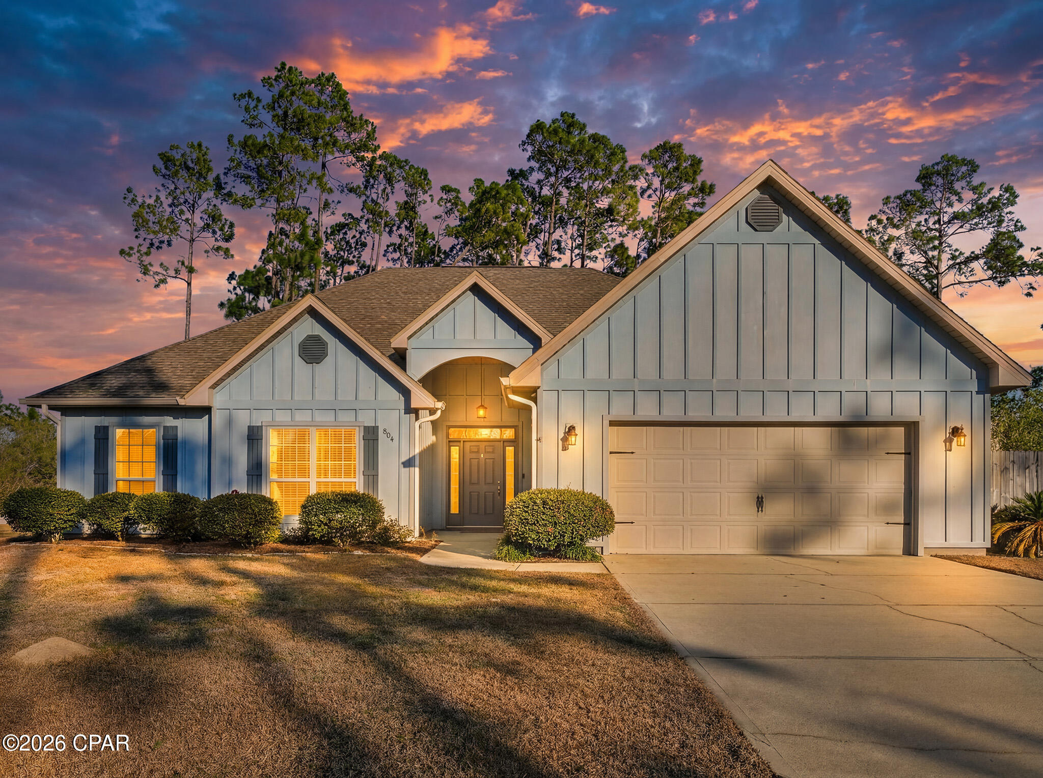Tucked away in the gated waterfront community of Laird Point, this beautiful 4-bedroom, 2.5-bath home offers a rare combination of privacy, nature, and access to coastal lifestyle.

Set on a quiet street bordered by mature trees and natural buffers, the setting feels peaceful and removed -- yet you're still just minutes from daily conveniences. 

Imagine relaxing mornings on the screened porch, afternoon pickleball matches with neighbors, and weekends launching from the nearby boat ramp for a day on East Bay. Life here is meant to be lived outside as much as in.

Inside, 14-foot tray ceilings elevate the main living area, creating an open and airy gathering space ideal for hosting or simply unwinding at the end of the day. 

The kitchen blends function and flow with generous cabinetry, stainless appliances, pantry storage, breakfast bar seating, and a casual dining nook. A separate formal dining room offers flexibility for holidays, celebrations, or entertaining friends.

The primary suite provides a true retreat, complete with a soaking tub, separate shower, double vanity, and spacious walk-in closet. Three additional bedrooms offer versatility for children, guests, remote work, or hobbies.

Step outside to a fully fenced backyard with room to relax, play, garden, or expand your outdoor vision. 

Laird Point residents also enjoy RV and boat storage -- all for an exceptionally low $400 annual HOA.

Located approximately 11 miles from Tyndall Air Force Base, 18 miles from NSA Panama City, and within easy reach of beaches, schools, and shopping, this home balances accessibility with serenity.

If you're looking for a home that supports the way you want to live -- not just where you need to commute -- this one delivers. Schedule your private tour today and make it your home tomorrow.