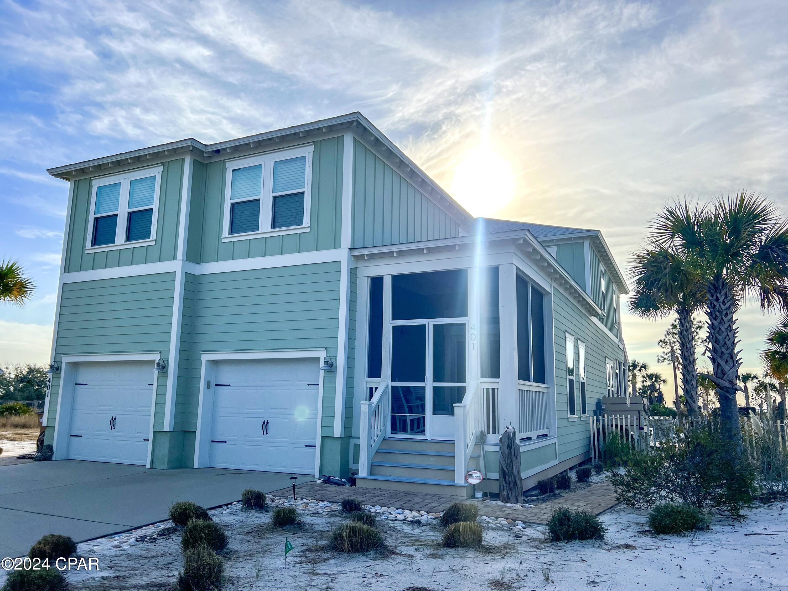 Immerse yourself in turnkey luxury with unobstructed views and glorious sunsets sinking into the waters of the Gulf of Mexico and St Joseph's Bay. Located in the coveted Windmark Beach Community, this beautifully decorated home is truly a rare find. Unlike most beach homes, this property has never been rented and has been the homestead residence for the owner since purchasing new in 2019. Larger than most of the surrounding homes and boasting bedrooms and baths with over 3000 sq ft of well design space that is complemented with screened front and back porches as well as master suite covered balcony that affords year round breathtaking sunsets. A large xeriscape gulf view backyard is complete with a pool, volleyball court, and generous lounge space that is all secured by a polished aluminum parameter fence. FIRST LEVEL- Main entry with screened porch, double garage with private entry, powder room with granite topped vanity, nice sized foyer with 2nd level access, dining room with water views, large kitchen with; stainless Frigidaire Appliances; gas range, electric oven, microwave, dishwasher, large refrigerator, double sink w/ disposal, subway tile backsplash, granite countertops, large island bar with granite top, walk-in pantry. A large great room with gulf and pool views gives way to an expansive screened in porch. 2ND LEVEL consists of a massive master suite with En suite (double vanity granite countertops, garden tub, separate shower), gulf view sitting area, private covered balcony, ship lap accents, and walk-in closet. Additional bedroom with En suite and walk-in closet as well as two other bedrooms that share a full bath, spacious laundry/ utility room with storage rounds out the second level. Whether entertaining friends and family or looking for an investment opportunity with outstanding income potential, this is a must-see property. All dimensions obtained from the original house plan or GulfPA. Owner modified the gulf view master sitting area.