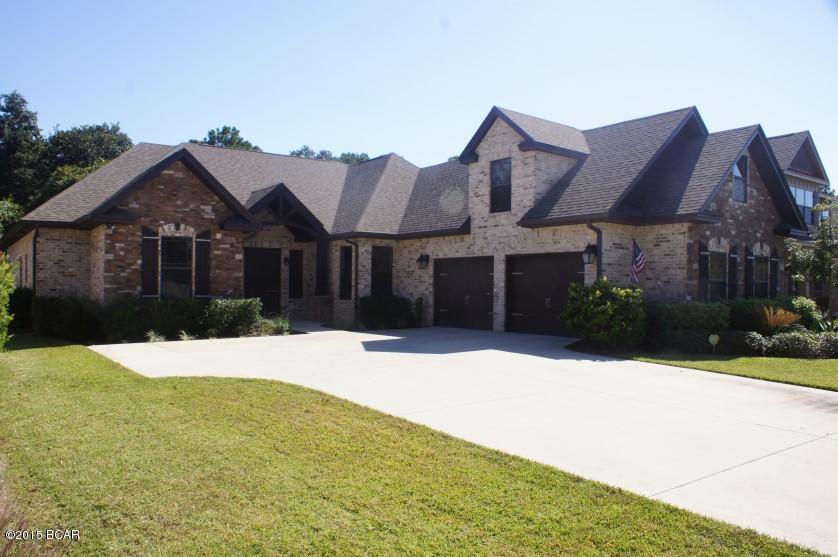 This beautiful custom built 5 bedroom 4 & 1/2 bath home is astounding.  You must see it to believe.  Stone Archway as you enter the home. The kitchen has granite countertops, stainless steel appliances, copper farm house sink, a pot filler on the stove and beautiful arched stone around stove. The family room has custom built shelves.  The enclosed porch is being used as a man cave. The man cave has tv hookup with an outdoor fireplace that has gas line for a grill. The large separate dining room with a butler's pantry. The mother in law suite is located above the oversized garage with extra storage.  Special storage above all the closets.  Large laundry room.  Large closets in all the kids rooms.  Crown molding in all the rooms including the bath rooms and baseboards have the large molding. This is a custom built home with granite throughout.  The yards are beautifully landscaped and it is tiered down in the back behind the lap pool that is caged. The saltwater pool has a heater.  All sizes are approximate.  If measurement is important please have measure.