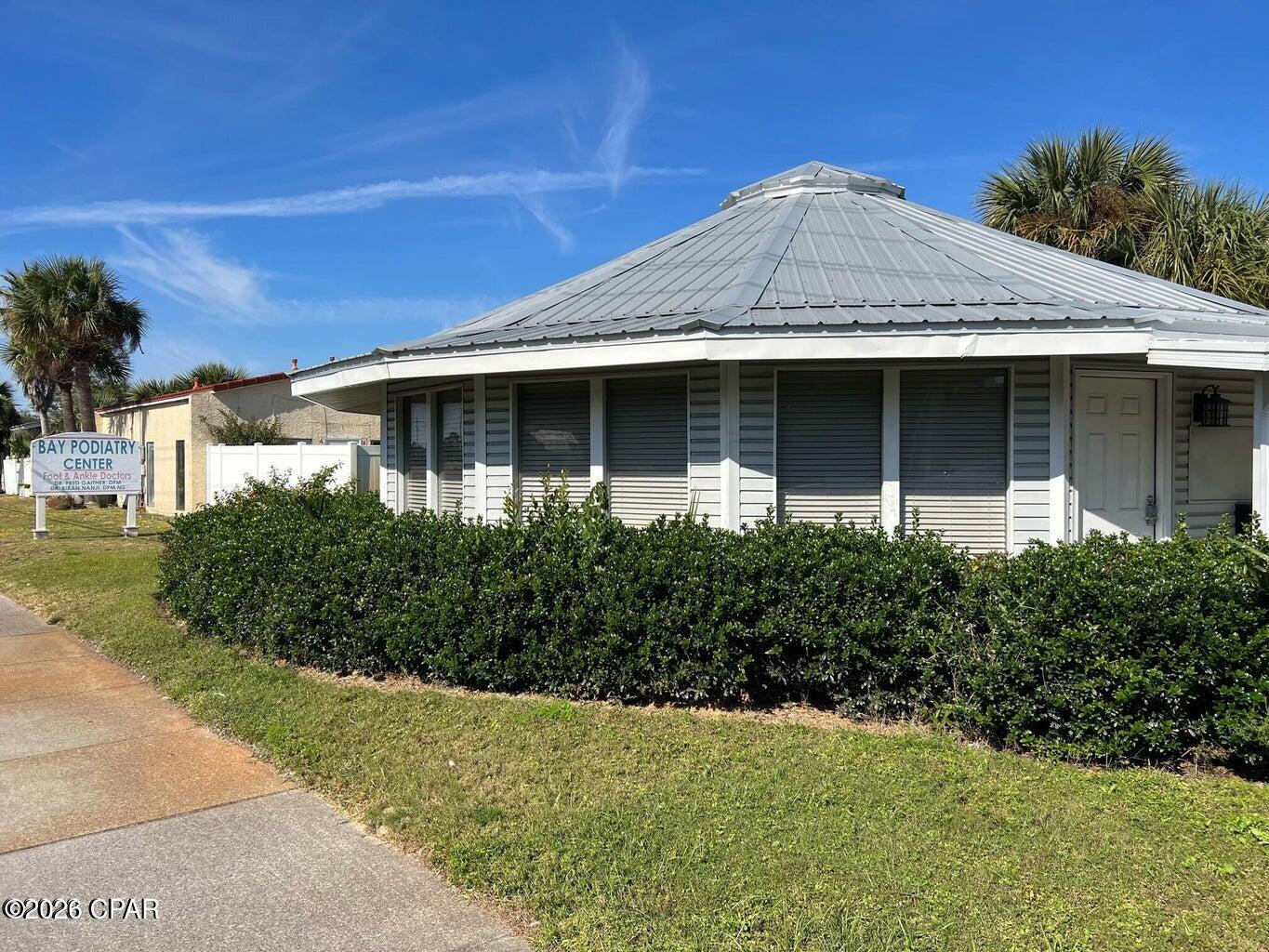 Prime location with heavy traffic on Middle Beach Rd / Hutchison Blvd.  Directly across the street from the Wicked Wheel.  Move In Ready.  3 offices and 2 bathrooms.  Tons of Light.  Well insulated, can barely hear the traffic.  New AC in 2025.  Shared access to digital sign on Hutchison. Perfect for law office, title company, mortgage lender, accountant, retail gifts shop and more.  Must​​‌​​​​‌​‌​​​​‌​​‌​​​​‌‌ see!!