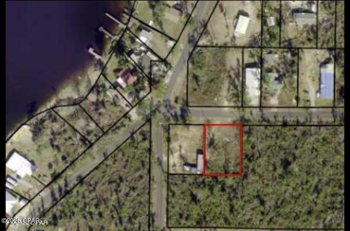 Discover the peace and charm of country living with scenic neighborhood views of Deerpoint Lake. This vacant lot in the desirable Bay Head community offers the perfect opportunity to build your dream home. Conveniently located just half a mile from a public boat ramp and picnic area, you'll enjoy easy access to outdoor recreation and waterfront activities.

The property includes existing septic, well, and electrical access (condition and functionality unknown), providing a head start for future development. Currently zoned R-1 for single-family residential use, this lot is ready for your vision to come to life.