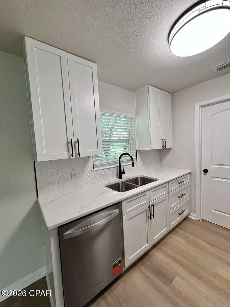 100% UPDATED HOME - BOAT LAKE FRONTAGE - SUNNY HILLS
100% Updated home on Leisure Lake! Brand-new kitchen with granite backsplash and stainless-steel appliances, updated bathrooms, new lights and fans, new textured ceilings, newer windows, new flooring, and fresh paint inside and out. Plus a 2018 AC, 2026 mini-split in the family room, and a metal roof for long-term durability.

Fantastic deal on Boat Lake in the Sunny Hills community -- a rare chance to own direct lake frontage with unobstructed views of one of the Panhandle's most beautiful spring-fed lakes. This 2/2, 1,333 sq ft handyman special sits on a premium lakefront lot with endless potential.

Wake up every morning to a BEAUTIFUL VIEW OF BOAT LAKE, known for its white-sand shoreline, crystal-clear water, and natural sandy bottom. Step right into fishing, swimming, kayaking, and enjoying Florida's natural beauty from your own backyard.

Waterfront Features
Waterfront Type: Lakefront

Waterfront Feature: Natural Shoreline

Waterview: Lake - Unobstructed

About Boat Lake
Boat Lake is the #1 attraction in Sunny Hills -- a 44-acre, spring-fed lake featuring:

White-sand beach

Clear-water swimming area

Picnic areas

Seasonal community events

Family-friendly swim park

4.6 stars (88 reviews)

Loved for its clean water and peaceful setting

Community Highlights
Sunny Hills offers:

Low taxes

No mandatory HOA

Quiet streets and natural surroundings

Easy access to Hwy 77, I-10, and Panama City / Panama City Beach
