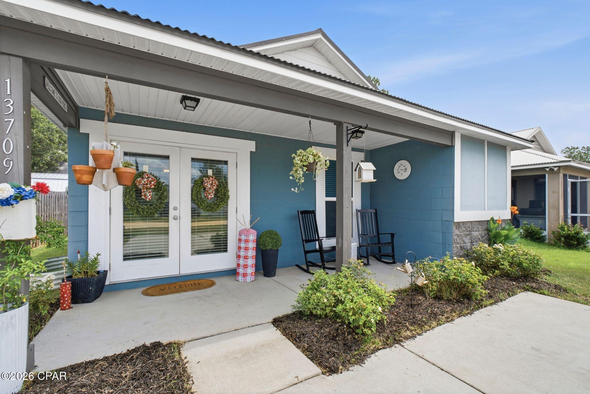 Welcome to this beautifully built 2-bedroom, 2-bath home offering the perfect combination of durability, efficiency, and low-maintenance living. Constructed with solid concrete block and topped with a durable metal roof, this home is designed to provide years of comfort and peace of mind.

Inside, you'll find an inviting open-concept floor plan with stylish concrete floors throughout, creating a clean, modern look that's both attractive and easy to maintain. The kitchen features stainless steel appliances, Formica countertops, and a convenient breakfast bar that flows seamlessly into the living and dining areas--perfect for everyday living or entertaining guests.

Built with quality and efficiency in mind, this home includes a 17 SEER HVAC system, Low-E energy-efficient windows, a secondary roof water barrier, a septic system, private well water, and a concrete driveway.

Enjoy relaxing mornings or evenings on the covered front porch, and a spacious lot offering plenty of room to enjoy the outdoors without the restrictions of an HOA.

Conveniently located in a quiet area north of Panama City near Highway 231 and Highway 20, you'll enjoy easy access to shopping, dining, and recreation while still appreciating the privacy of country living. Just 30 minutes from Panama City and approximately 40 minutes from Panama City Beach, this home offers the ideal balance of tranquility and convenience.

Whether you're looking for a primary residence, a second home, or an investment opportunity, this move-in-ready property is one you won't want to miss.