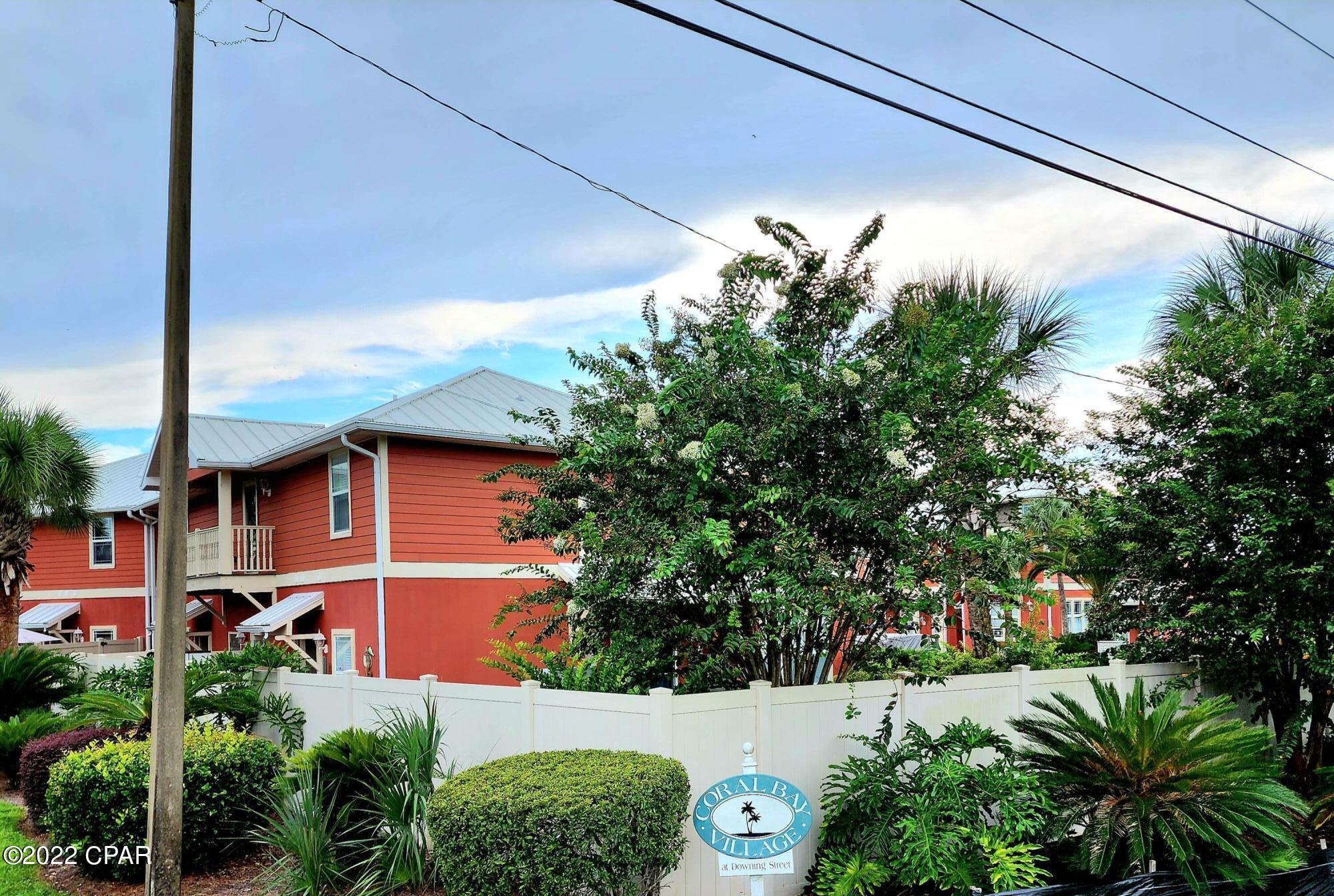 Come and experience Coral Bay Village! This Key West architecture inspired townhome is sure to please! Located on the highly desirable West End, just blocks to the beach, close to 30A, and only a few miles to the infamous Pier Park with tons of shopping and restaurants. The 3 bedroom 2 ½ bath floor plan features high ceilings and a Juliet balcony. The kitchen shines with granite countertops and new stainless-steel appliances.  Newer W/D and HVAC (2020). Don't feel like going to the beach? Relax in the community pool just steps away from your front door or grill and socialize on the beautiful tropical landscaped patios. Coral Bay is a golf cart friendly community. Did I mention with an acceptable offer this unit can even come with a Yamaha gas golf cart that the owner purchased new in 2020