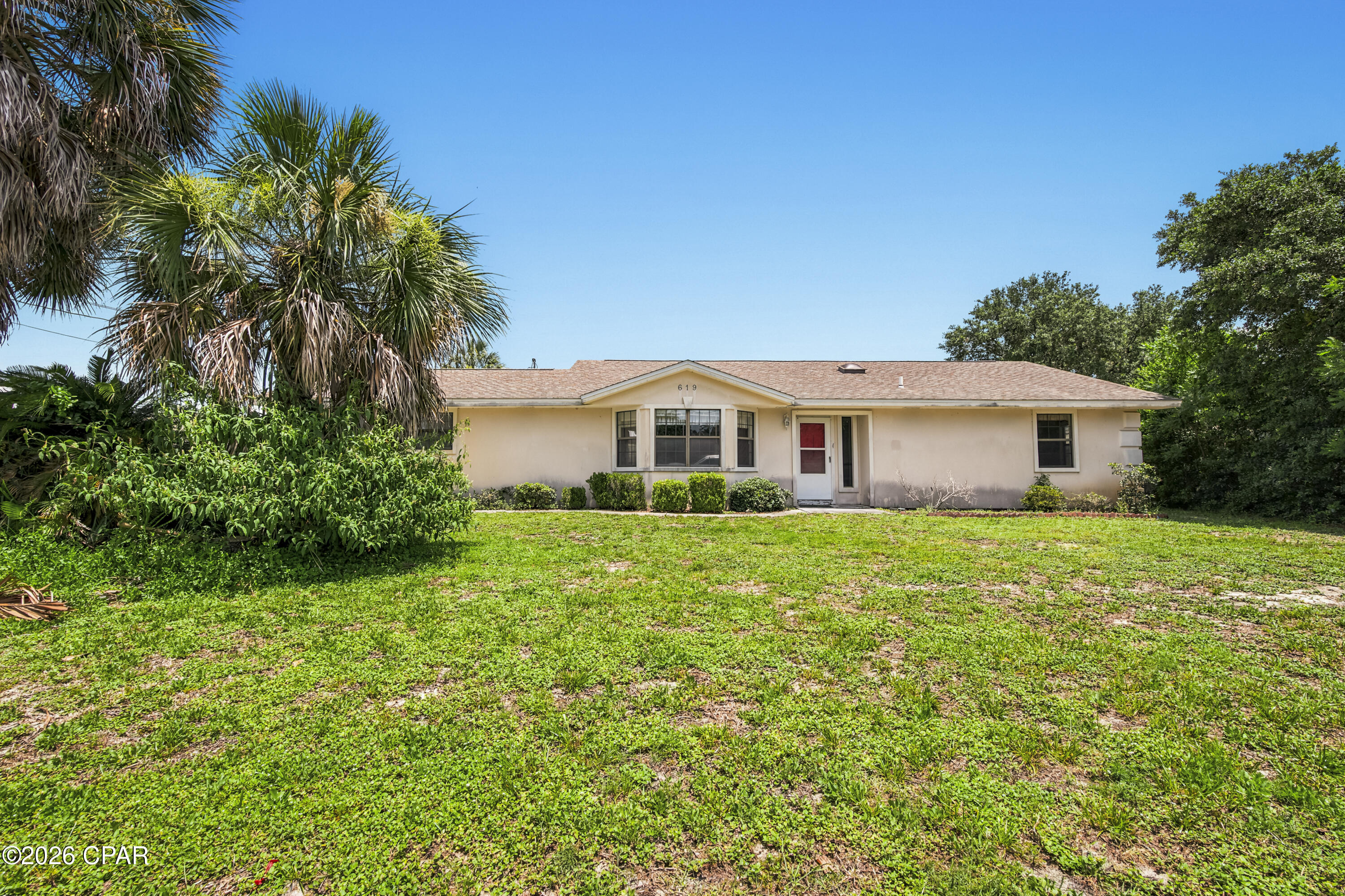 Welcome to your opportunity to own a piece of the highly sought-after West End of Panama City Beach! Located just steps from the sugar-white sand and emerald waters of the Gulf, 619 16th Street offers the perfect combination of coastal living, investment potential, and endless possibilities. Situated on an oversized lot with an expansive driveway, this home is ready for its next chapter. Currently featuring two spacious bedrooms, the existing floor plan provides an excellent opportunity to create a third bedroom--instantly adding functionality and increasing the property's overall value. Whether you're searching for a primary residence, vacation home, or investment project, this property offers the flexibility to make it your own. Step outside and you'll find even more potential. The backyard features an in-ground pool that is not currently operational but provides an exciting opportunity to restore your own private oasis. The generous lot also offers space in the left rear corner for a future mother-in-law suite, guest house, pool cabana, or workshop (subject to local regulations), making this property as versatile as it is desirable. Location is everything, and this home delivers! Just moments from the pristine beaches of the Gulf and minutes from Carillon Beach, you'll enjoy one of the most desirable stretches of Florida's Emerald Coast. Spend your days exploring boutique shops, waterfront dining, scenic walking and biking paths, nearby parks, and world-class beaches, all while everyday conveniences like grocery stores, restaurants, coffee shops, and entertainment remain just minutes away. Here, everyday living truly meets the relaxed luxury of the beach lifestyle. For buyers with vision, this is an exceptional opportunity to renovate, customize, and build instant equity in one of Panama City Beach's fastest-growing and most desirable areas. Whether you're looking to create your dream beach retreat or maximize your investment, the possibilities here are endless. Don't miss your chance to unlock the full potential of this rare West End property just a block from the beach.