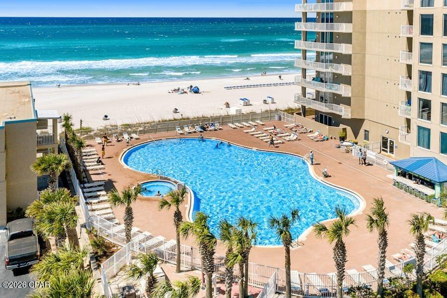 Gulf-Front Condo at Tidewater Beach Resort | Turnkey Rental Opportunity

Experience breathtaking Gulf views from this beautifully updated and fully furnished 3-bedroom, 3-bath condo on the 14th floor of Tidewater Beach. Offering 1,865 square feet of living space, this spacious residence features an open floor plan with panoramic water views from the kitchen, living area, and Gulf-front primary suite.

The well-appointed kitchen includes granite countertops, stainless steel appliances, a wraparound breakfast bar, ample cabinetry, and a pantry. The primary suite offers direct balcony access, stunning Gulf views, and a spa-like bath with a soaking tub, separate shower, and double vanity. Each guest bedroom includes its own private bathroom.

Residents and guests enjoy the lifestyle amenities, including two beachfront pools, an indoor heated pool, hot tubs, sauna, fitness center, theater, arcade, owner's lounge, covered parking, 24-hour security, and over 600 feet of beachfront access.

Located just minutes from Pier Park, this exceptional Gulf-front property is ideal as a vacation home, primary residence, or income-producing rental investment.