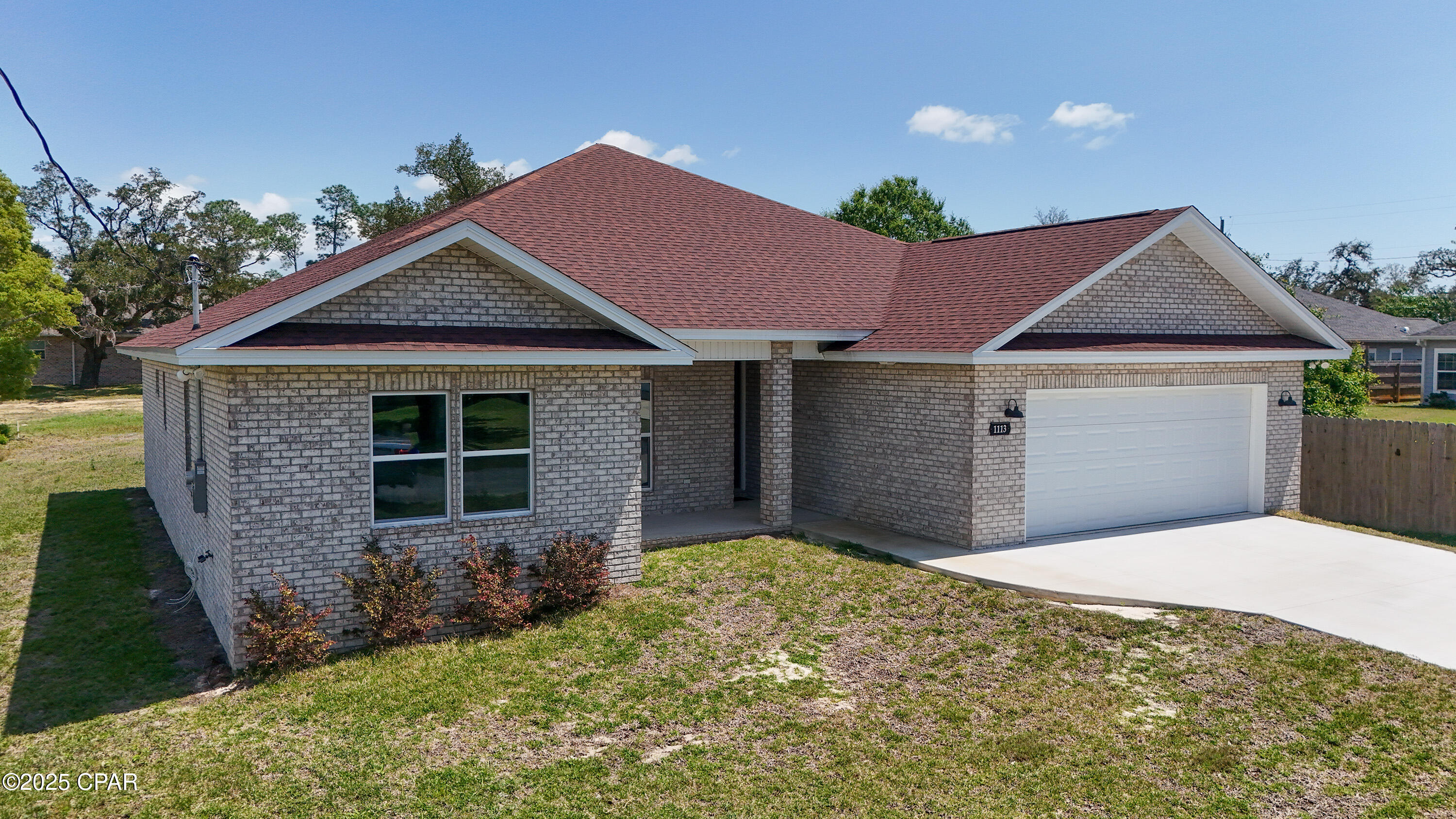 New Construction - All Brick 4BR/2.5BA Custom Home in Lynn Haven | 2,350 Sq Ft

Beautifully designed and newly built, this 4-bedroom, 2.5-bathroom all-brick custom home offers 2,036 sq ft of living space on a wonderful lot in the desirable community of Lynn Haven.  During construction, every exterior wall and every square inch of the roof was coated with foam insulation.  Yes, even the attic area is insulated from the summer heat, making this one of the most energy-efficient homes available.  The home features a 10-foot tray ceiling in the living room, a 9-foot tray ceiling in the master suite, and 9-foot ceilings throughout. Interior finishes include luxury vinyl plank flooring in main areas and bedrooms, with tile flooring in all bathrooms.  The kitchen is a standout, showcasing a large island, pantry, abundant cabinetry, and beautiful hard-surfaced countertops—perfect for everyday living and entertaining. The master suite includes a custom tile shower, double vanities, and a spacious walk-in closet.  An oversized 24' x 24' garage provides plenty of space for vehicles and storage.  The attic above the garage is decked and serves as another storage area.  Enjoy the outdoors from the covered patio, featuring an extended wooden deck that provides even more room to relax or host guests.  No HOA. Convenient to top-rated schools, parks, shopping, and the bay. This is high-quality new construction with thoughtful upgrades throughout—schedule your private showing today!

Measurements are approximate.
