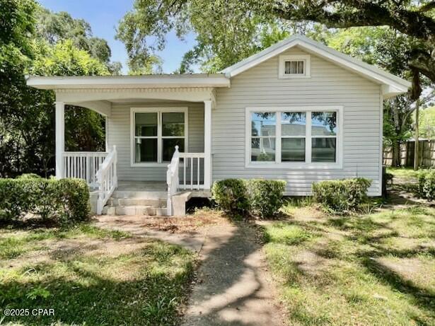 * SELLER MOTIVATED *  Exquisitely updated home and detached apartment in lovely Graceville, Florida.   The yard is graced with beautiful majestic oaks.  The main house has a large living area just right for entertaining.  The large kitchen has lots of cabinets and storage area.  A nice feature is the large master bedroom that has a fireplace.  There is a covered front porch with new tiled floor and there also is a nice side porch.  In the back yard you have the apartment that has a large living/bedroom combo area and there is a kitchen and a​​‌​​​​‌​‌​​​​‌​​‌​​​​‌‌ bathroom.