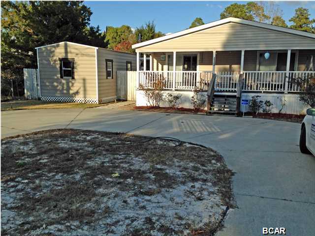 Quiet country setting among the trees. Large front porch to view the evening sunset. Bright and light kitchen, large living room, backyard hot tub and above ground pool with surround deck. Large screened lanai off the living room allowing entrance to the pool. The master bathroom as a walk in tub with a door. Age, SF Lot and room sizes are approximate. Please verify if important.