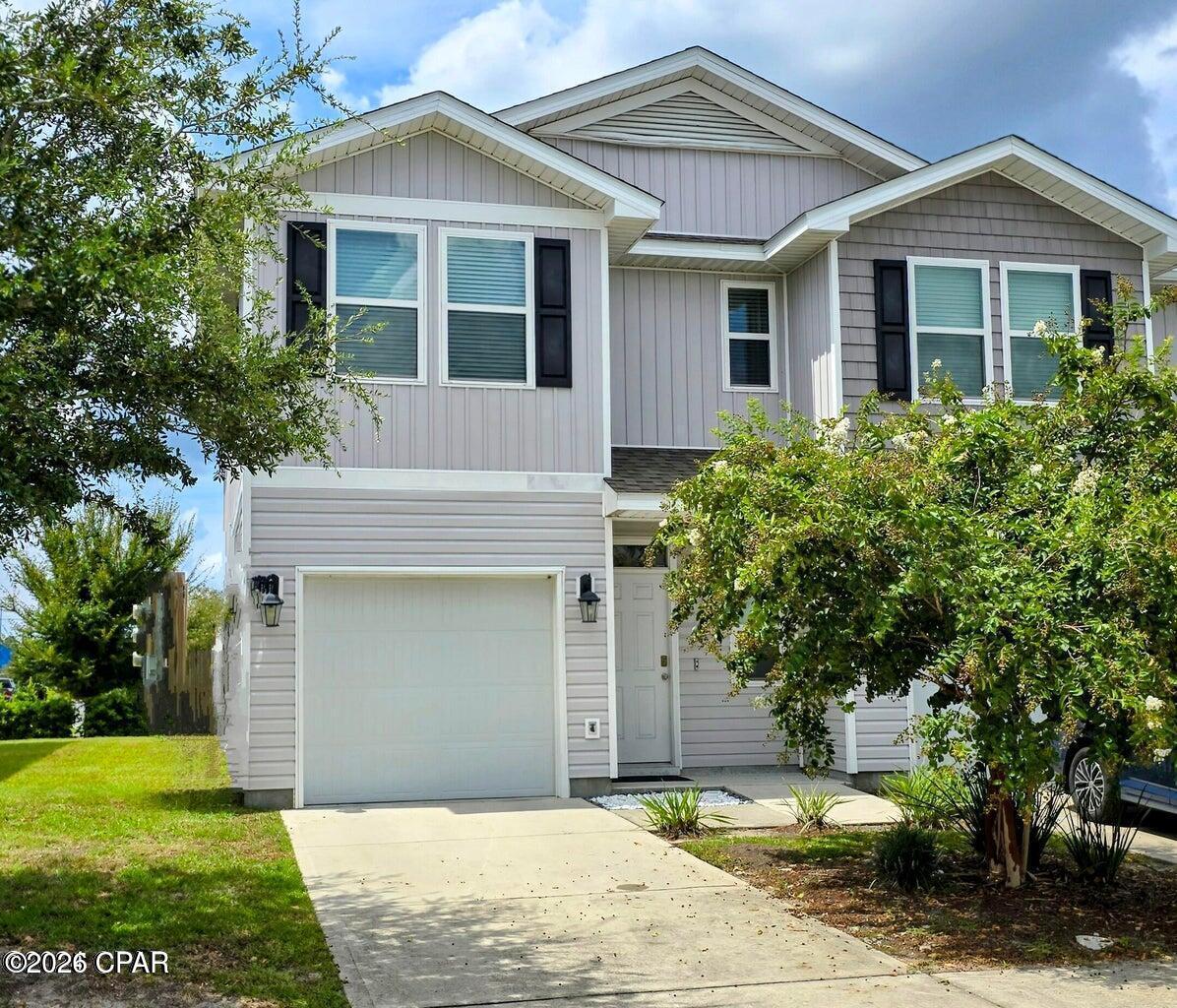This End Unit has 3 bedrooms, 2.5 bathrooms featuring carpeted bedrooms, a large master suite with double vanity, walk-in shower, a large walk-in closet, vinyl-fenced backyard space with a gate, ADT Security entry point package and motion sensor, stainless steel appliances and is within walking distance to shopping, restaurants, gyms, and the lovely community pool across the street. Within 7 miles of Tyndall Airforce Base and short distance to beautiful beaches. Rent includes garbage, lawn care. Small dog upon approval. Application and minimum of 12 month lease.