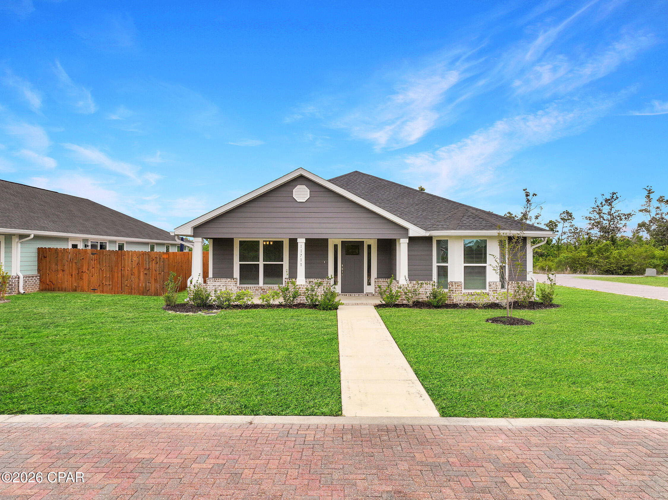 This beautifully built 2024 home offers 3 bedrooms, 2 bathrooms, and a bright, open layout that's designed for comfortable everyday living.  From the moment you walk in, you'll notice the clean, modern feel with quartz countertops, durable finishes, and a spacious living area that flows easily into the kitchen and dining space--perfect for both relaxing and entertaining. The bedrooms are generously sized, and the primary suite offers a private retreat with a walk-in closet and plenty of room to unwind at the end of the day.  This home also includes several thoughtful upgrades, including gutters, a hybrid water heater, window coverings, Kevlar hurricane window blankets, and an oversized corner lot, giving you added comfort, efficiency, and peace of mind.  Outside, the inground sprinkler system helps keep your yard looking great year-round, and with a nearly new roof and construction, you can enjoy low-maintenance living for years to come.  Located in the Sunrise at EastBay community, this peaceful bayside neighborhood is known for its laid-back ''Old Florida'' charm. Tucked along the Intracoastal Waterway, it's an ideal spot for anyone who loves being on or near the water. Spend your days boating, fishing, or exploring--Shell Island and the Gulf of Mexico are just a short 15-minute boat ride away.  You're also just 20 minutes from Tyndall AFB and about 30 minutes from Northwest Florida Beaches International Airport, making commuting and travel easy.  Whether you're looking for a full-time residence, a second home near the water, or an investment opportunity in a growing area, this home offers a great combination of location, quality, and lifestyle.  Come see what makes EastBay such a special place to call home!