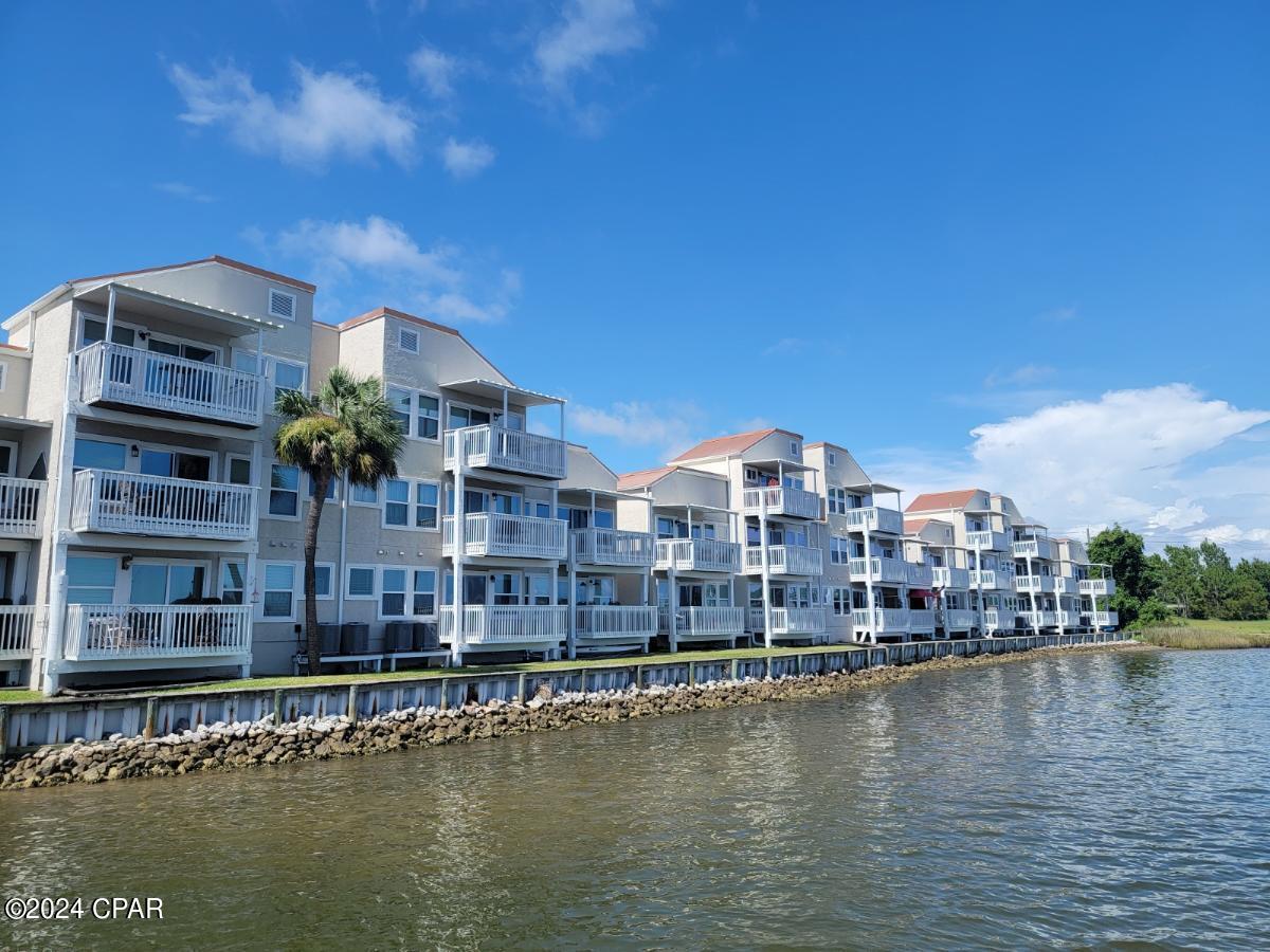 Welcome to Bayou Pointe Villas which sits on beautiful Watson Bayou. This a 1 bedroom, 1 bath furnished waterfront condo with a waterview.  This condo is located on the 2nd floor and has been renovated. The kitchen features Stainless steel appliances, including dishwasher, stove, refrigerator, and microwave. Breakfast bar with granite countertops.  Washer and dryer are also included.  This community is private and gated.  The rent includes water, sewer, garbage, and internet. This location is convenient to downtown Panama City shopping & restaurants. As well as historic St. Andrews, Ascension Sacred Heart Hospital, Tyndall AFB, beaches, and much more! A boat slip is also available and can be rent separately for $350.00 per month. Application required. No Pets. Call to schedule tour!