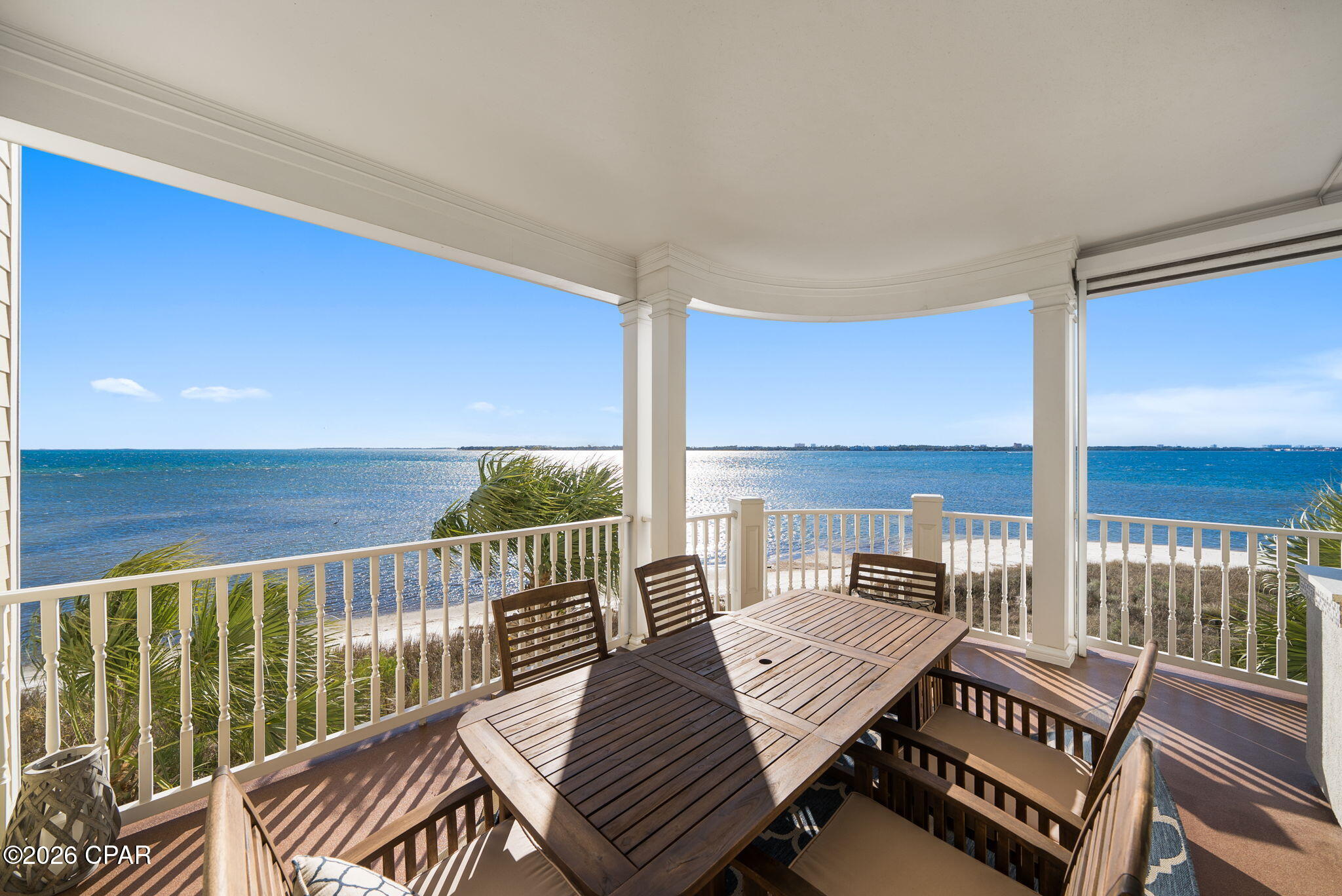 Positioned along the waterfront with sweeping views and an effortless sense of refinement, this exceptional luxury condominium offers a rare blend of sophisticated design, elevated comfort, and lock-and-leave convenience.

Perfectly located adjacent to historic St. Andrews, owners can step beyond the gates and immediately immerse themselves in one of Bay County's most beloved waterfront districts. Enjoy walkable access to locally owned restaurants, cocktail lounges, live music, boutique shopping, weekend farmers markets, waterfront parks, and marina life -- all set against the charm and character that have made St. Andrews a destination for generations. From spontaneous sunset dinners and morning coffee walks to boating, fishing, and year-round community events, the lifestyle offered here extends far beyond the residence itself.

Thoughtfully curated with an emphasis on timeless quality over trend, the residence showcases unparalleled finishes throughout, including authentic silver birch wood flooring, commercial-grade professional KitchenAid appliances, integrated Sonos surround sound, and beautifully tailored living spaces designed for both everyday comfort and elegant entertaining.

Expansive walls of glass invite natural light across the main living areas while seamlessly connecting the interior to the oversized waterfront balcony -- an extension of the home itself. Complete with a built-in outdoor kitchen and gas grill, the balcony creates the perfect setting for sunset dinners, quiet mornings overlooking the water, or entertaining guests against a breathtaking coastal backdrop.

Unlike many luxury waterfront residences, this home offers the ease and practicality of main-floor living, allowing effortless access for both owners and pets without the inconvenience of elevators or stairs becoming part of daily life.

The primary suite and living spaces were designed to prioritize comfort, privacy, and understated elegance, creating an atmosphere that feels more akin to a private coastal retreat than a condominium.

Residents enjoy access to resort-style amenities, including a heated pool maintained at approximately 80 degrees year-round, all while surrounded by one of the area's most exclusive waterfront settings. (HOA Dues include the following: Gas, Cable, Internet, Common area dues, Residential area dues, water, sewer, garbage, pest control.)

This is a residence for the buyer who values craftsmanship, discretion, and lifestyle equally -- a rare opportunity to own a truly distinguished waterfront property where luxury speaks quietly, yet unmistakably.