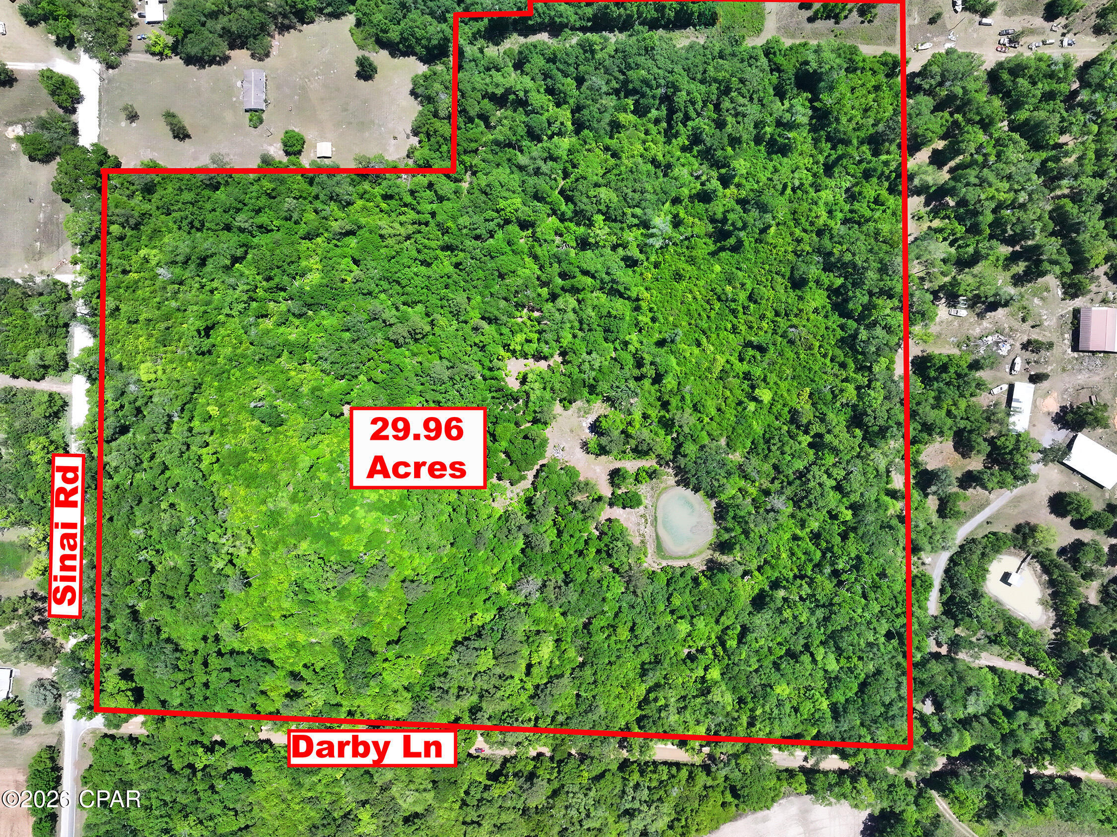 Tucked away in the quiet countryside of Sneads, this nearly 30-acre property offers the space, privacy, and natural beauty that so many buyers are searching for--but rarely find with this level of accessibility and infrastructure already in place.
Comprised of two parcels being sold together, the land features a mix of mature hardwoods and pines, creating a peaceful, wooded setting ideal for a private homesite, recreational retreat, or future homestead. A road has already been cut into the property leading to a potential homesite, giving you a head start on bringing your vision to life.
A standout feature is the on-site pond, adding both scenic appeal and potential for relaxation, wildlife watching, or outdoor enjoyment. Power has been run in two locations, and a well is already in place--significant improvements that add value and convenience for future development. No septic is currently installed, allowing flexibility in design and placement.
Located just minutes from Lake Seminole, this property puts world-class fishing, boating, and outdoor recreation within easy reach. Nearby Three Rivers State Park and the Apalachee Wildlife Management Area offer additional opportunities for hiking, hunting, and exploring North Florida's natural landscape.
Despite its private, rural feel, the property is conveniently situated with access to I-10 and is roughly equidistant to Marianna, Chipley, and Tallahassee, making travel, shopping, and healthcare easily accessible--including Jackson Hospital just a short drive away. The town of Sneads provides everyday conveniences including a well-supplied grocery store, restaurants, and charming locally owned shops.
Whether you're looking to build, invest, or create your own North Florida retreat, this property offers a rare combination of acreage, location, and existing improvements.

NOTE: The listing consists of two parcels being sold together. Parcel ID  
03-3N-07-0000-0010-0010 is 10 acres. Parcel ID  
03-3N-07-0000-0010-0020 is 19.96 acres. List price is for the combined 29.96 acres. Seller is not willing to sell the parcels separately.