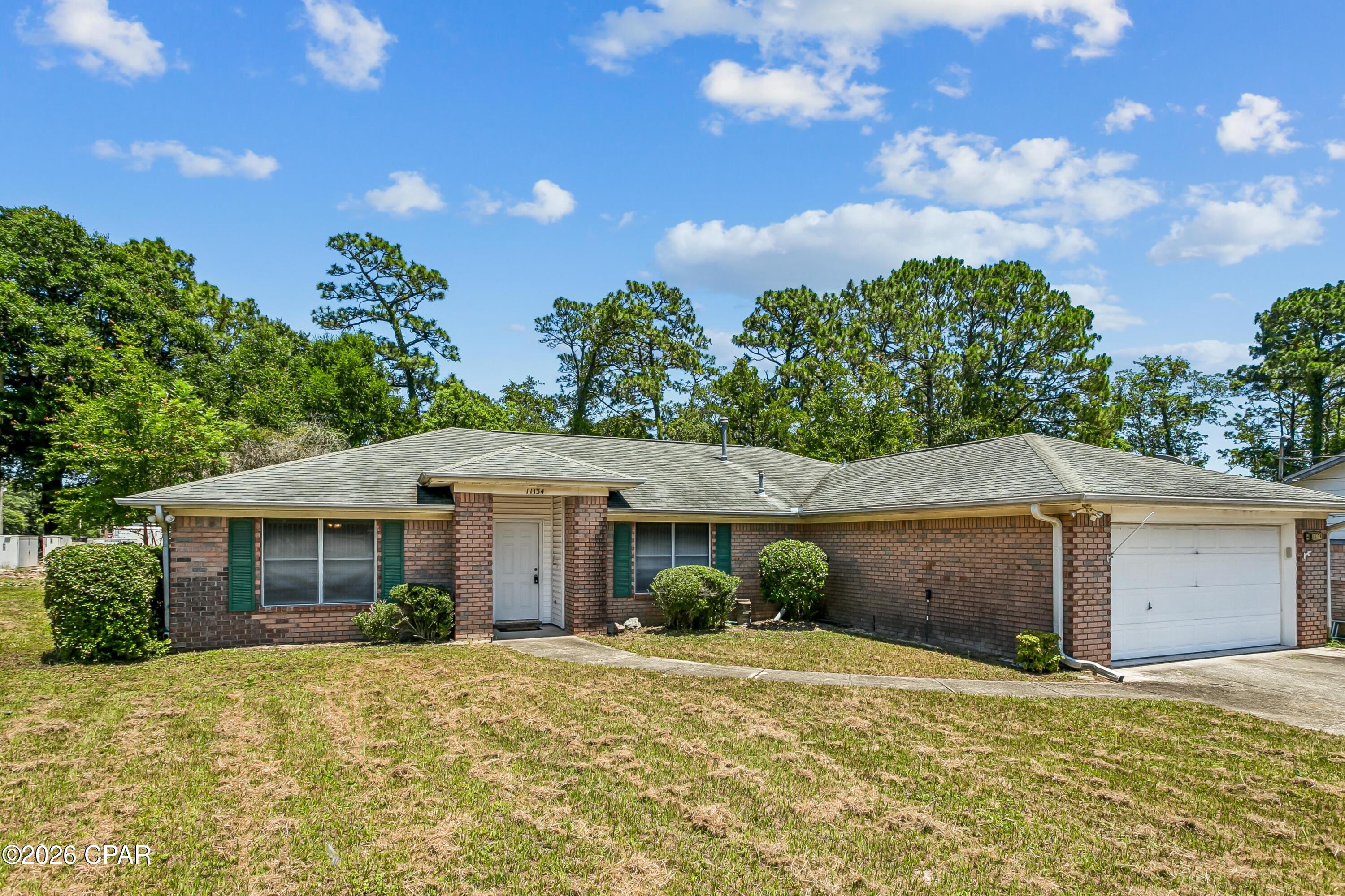 Priced to Sell in Pensacola! Seller to install a new roof prior to closing once under contract.

Located 5 minutes from the water at Perdido Bay, the property is a well-built, thoughtfully designed home situated on a large corner lot in a quiet and desirable Pensacola residential community. Built with pride by Escambia Construction and showing no damage from recent storms, this 3-bedroom, 2 full bath property offers comfort, space, and incredible potential.

Venture inside where you'll find an open great room featuring a vaulted ceiling, neutral carpet, a tiled wood-burning fireplace, and a lighted ceiling fan flowing seamlessly into the formal dining area. The dining space is open and spacious, complete with neutral carpet and a classic lighted fixture, making it perfect for both formal gatherings and everyday meals.

The eat-in kitchen offers an open concept layout with an abundance of oak cabinetry, a center island with breakfast bar, pantry, dual sinks, and neutral vinyl flooring. It also provides convenient access to the inside laundry area and 2 car garage.

A standout feature of the home is the 14x11 Florida room/sunroom, complete with opening safety glass windows ideal for relaxing year-round while enjoying natural light and outdoor views.

This brick home offers a solid opportunity for ownership with great potential it DOES need a little TLC, but it is absolutely livable as-is. With the right vision, you can truly make it your own while building equity. Even better, the seller is offering a brand-new roof with a strong offer, adding immediate value and peace of mind. 

Additional highlights include an RV/boat parking, or large recreational vehicle in a privacy-fenced backyard. The home is partially furnished with some heavy china cabinets conveying, and plenty of outdoor space to create your own oasis.

Buyer to verify exact square footage and lot size.

Don't miss your chance to own a spacious home with great bones, character, and room to grow--schedule your private showing immediately!!!