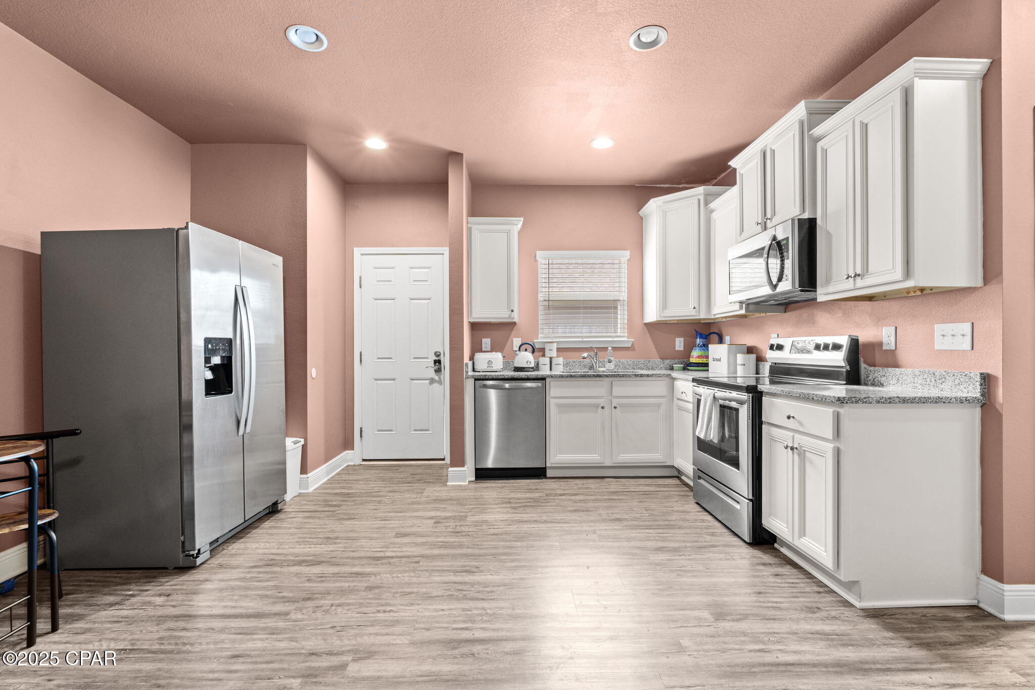 **PLEASE NOTE: The house is NOT pink. It's a boho Mauve/Brown color. This home is connected to another house and it is a duplex-style set up.** Small breed dogs under 25 lbs and Cat Friendly. This cozy one bedroom/one bath home in Bridge Harbor is the perfect boho retreat equipped with a full kitchen, laundry space, and full bath. This home comes furnished with a couch, queen size bedroom suite, all appliances, and a 50 in TV in the living room. Utilize what is provided but feel free to add your personal touches to make this place home! Bridge Harbor is located only 5 miles to Tyndall AFB and 17 miles to Panama City Beach. The community is also home to a wonderful community pool and a pavilion and outdoor grills to enjoy.