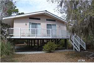 Looking for your next home? LOOK NO FURTHER! This is a great house in a great location. This 2 bedroom home has tons of natural light. There is a large living room with two sliding doors that open up to the wrap around porch. Both bedrooms are a good size and have their own 1/2 bath and share a shower/bathtub. The kitchen is spacious and opens up to the living room. This home is great for entertaining and is on 1/2 acre. Enjoy your privacy or entertain. You are 15 minutes from the beaches of the Emerald Coast. You don't want to miss this opportunity!