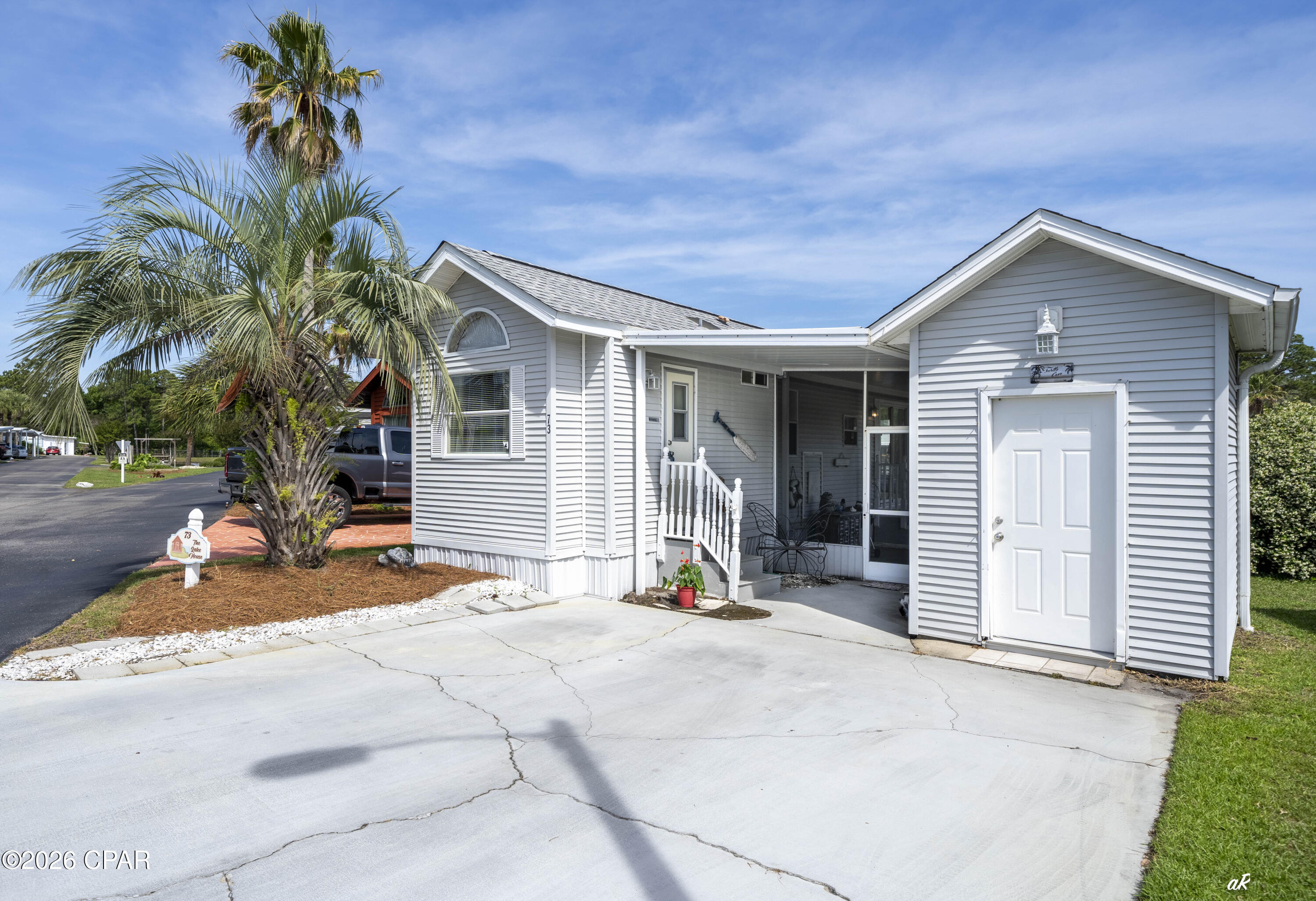 LAKEFRONT HOME with BEAUTIFUL VIEWS AVAILABLE at Emerald Pointe Resort. This one bedroom, one bath beauty comes complete with a screened lanai OVERLOOKING the private lake and boardwalk. It has an open floor-plan, separate 7x9 storage building outside with work bench, roof installed 7/19, APPLIANCES updated 2021 in kitchen, washer, dryer, stove and HVAC updated since 2023, and it's being sold furnished! This home would be an excellent primary residence, vacation home or rental property. Emerald Pointe is located in the heart of Panama City Beach close to restaurants, shopping, and the world's most beautiful beaches. It's is a golf cart friendly, gated community that offers a large clubhouse, exercise room, 2 pools (one heated seasonally), hot tub, private lake w/boardwalk and shuffleboard courts.