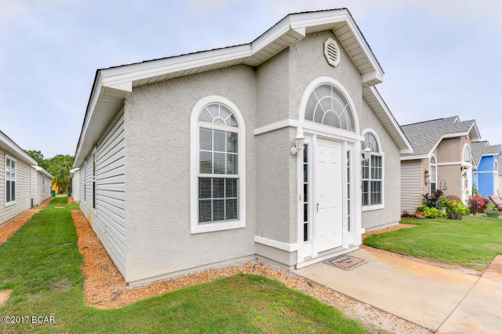 LOCATION LOCATION LOCATION. Nice 3 bedroom, 2 bath home in the highly sought-after gated community Palm Cove in Panama City Beach. This house is close to Pier Park, Shipwreck Island and within walking distance of the sugar sand beaches. Good sized eat-in kitchen is open to the large living area with laminate hardwood floors and vaulted ceiling. All new stainless steel appliances; dishwasher, stove/oven, fridge with icemaker. Palm Cove has community pool, kiddie pool and playground. Yard maintenance and garbage are included with rent. Pets and smoking are not allowed.