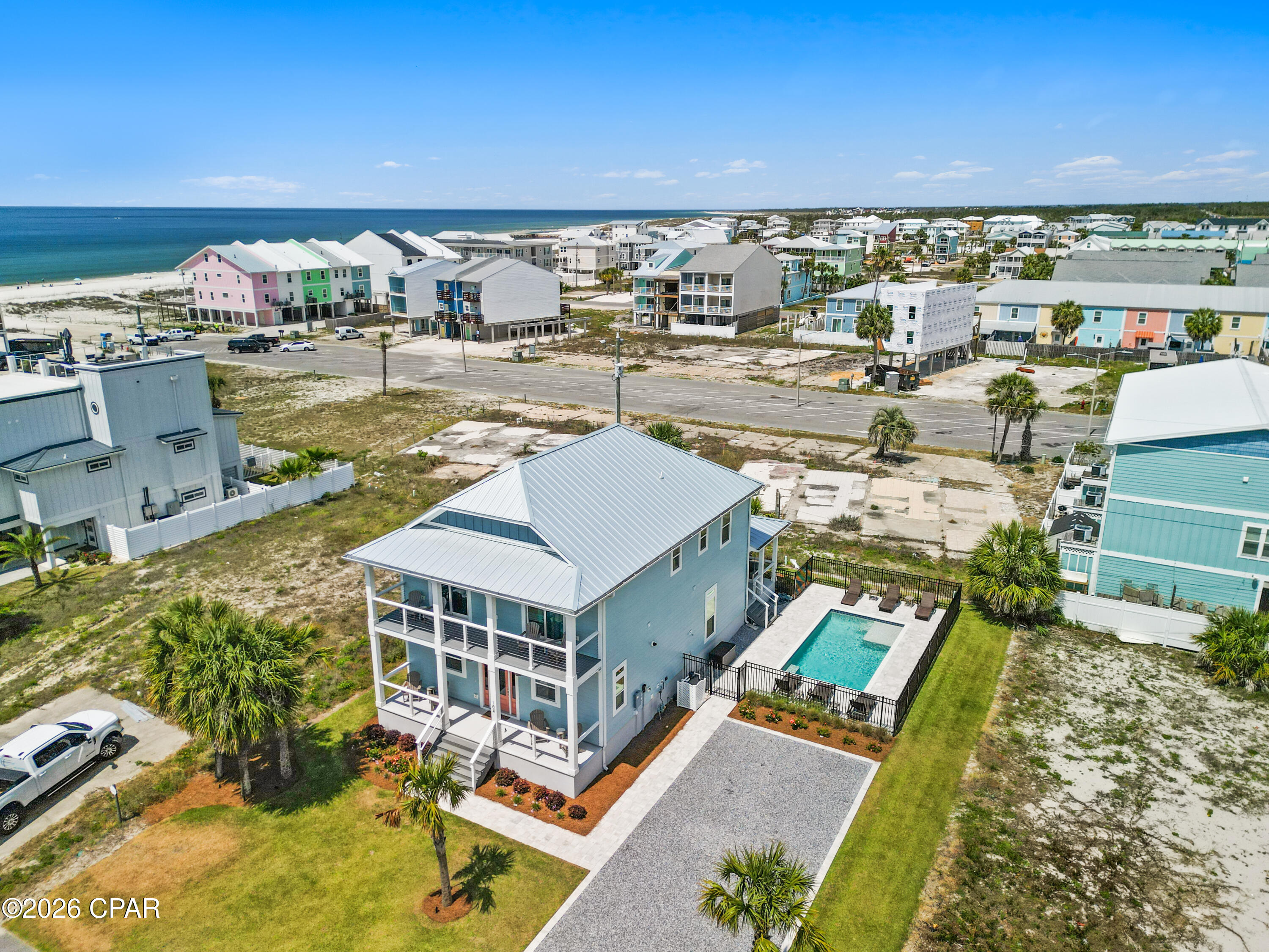 X FLOOD, PRIVATE POOL, GULF VIEWS! Virtual Tour available in listing! Experience elevated coastal living and impressive rental performance at this beautifully furnished Mexico Beach retreat. Built in 2023 and located just a short walk from the Gulf, this spacious five-bedroom, five and a half bath home has already produced approximately $84,000 in gross rental income during its first full year on the vacation-rental market. Offering buyers the rare combination of a luxurious beach getaway and an established income producing property. The thoughtfully planned interior provides 2,728 square feet of living space with plenty of room for owners, family and vacationing guests. An open kitchen, dining and living area creates a natural gathering place, while the upgraded GE Café appliances, generous island, pantry and stylish finishes make the kitchen both functional and inviting. Each bedroom enjoys convenient bathroom access, and the first floor primary suite offers added privacy and accessibility. An interior residential elevator makes moving between levels, and transporting luggage and groceries, effortless. Outside, the private gunite pool and landscaped gathering area provide a resort-like setting for afternoons in the sun, evening cookouts and relaxing after a day at the beach. Gulf views, multiple porches, an outdoor shower and a location near Mexico Beach's white sand shoreline further enhance the coastal lifestyle. Additional advantages include an X flood-zone location, no HOA, a metal roof, Hardie board exterior, natural gas, an on-demand water heater and public water and sewer. Offered furnished and ready for continued rental use or immediate personal enjoyment, this property is equally suited as a high performing investment, second home or full time coastal residence. https://my.matterport.com/show/?m=KzTBic9McLH