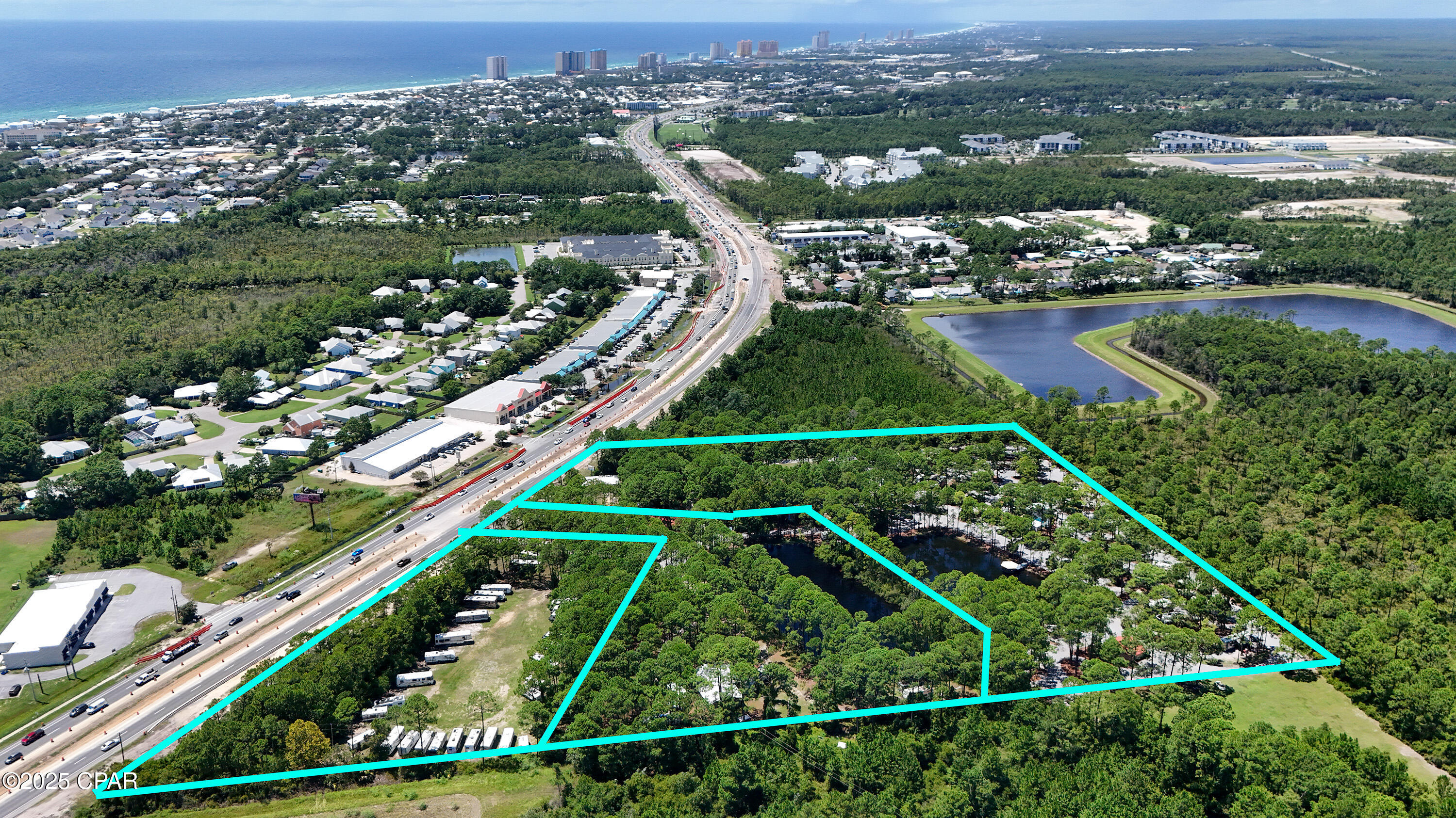 This 13.82 acre parcel is located directly on Panama City Beach Parkway with 6 acres of Hwy frontage prime for commercial development. Only 1 mile from the beach and 3 miles to Pier Park, this corridor is being set for commercial development with an shopping plaza directly to the east of the property. The parcel is connected to city sewer and water and is currently being used as an existing RV Park that is bringing in positive cash flow.  Great investment opportunity to have cash flow while waiting to develop the property. Panama City Beach Parkway is currently being expanded to 6 lanes which will provide ease of access to property when done.