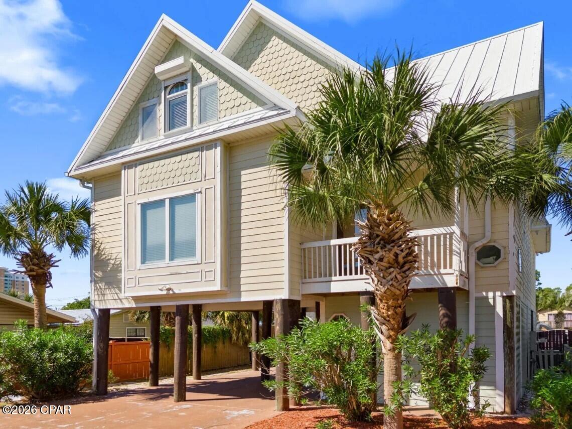 Rare and exceptional investment opportunity located on the East End of Panama City Beach in the desirable South Lagoon area. This 4-bedroom, 3.5-bath, 2,500+ sq ft home is being sold fully furnished and turnkey, with NO HOA and NO rental restrictions.
Situated on TWO lots just a few short blocks from beach access, this 3 story home is designed to maximize both guest experience and income potential. The first floor features a large game room with a pool table, TV and other games, while the main living areas offer ample space, perfect for entertainment and large groups. Step outside and you'll find what truly sets this property apart! The outdoor space is one of a kind featuring a heated custom lagoon style pool with a lazy river, swim up bar, waterslide, and jacuzzi.... all in the shape of a fish. Yes, a fish. Its the kind of feature guests talk about and rebook for. Add in the tiki bar, grilling area, and expansive outdoor space, and you have a private resort right in your back yard. The rear lot is gated and offers road access with a separate entrance, providing ample space for your boat, RV, or jet ski storage. Conveniently located near the public boat ramp with Gulf access, making trips to Shell Island quick and easy. With NO restrictions, the possibilities are endless. Properties with this level of amenities, lot size, and flexibility are extremely rare. This is more than home, its an experience and you don't want to miss out on it!