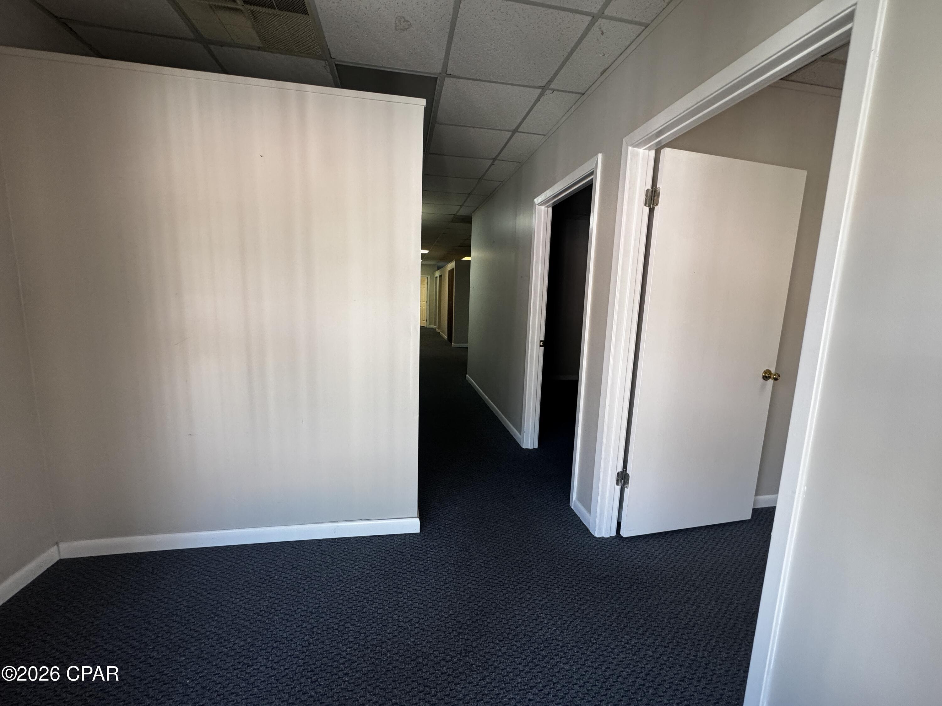 Located just west of the Hathaway Bridge in the open air Promenade Mall, this second floor office/retail space is currently configured for an office user, but could easily be built out to accommodate any retail user.