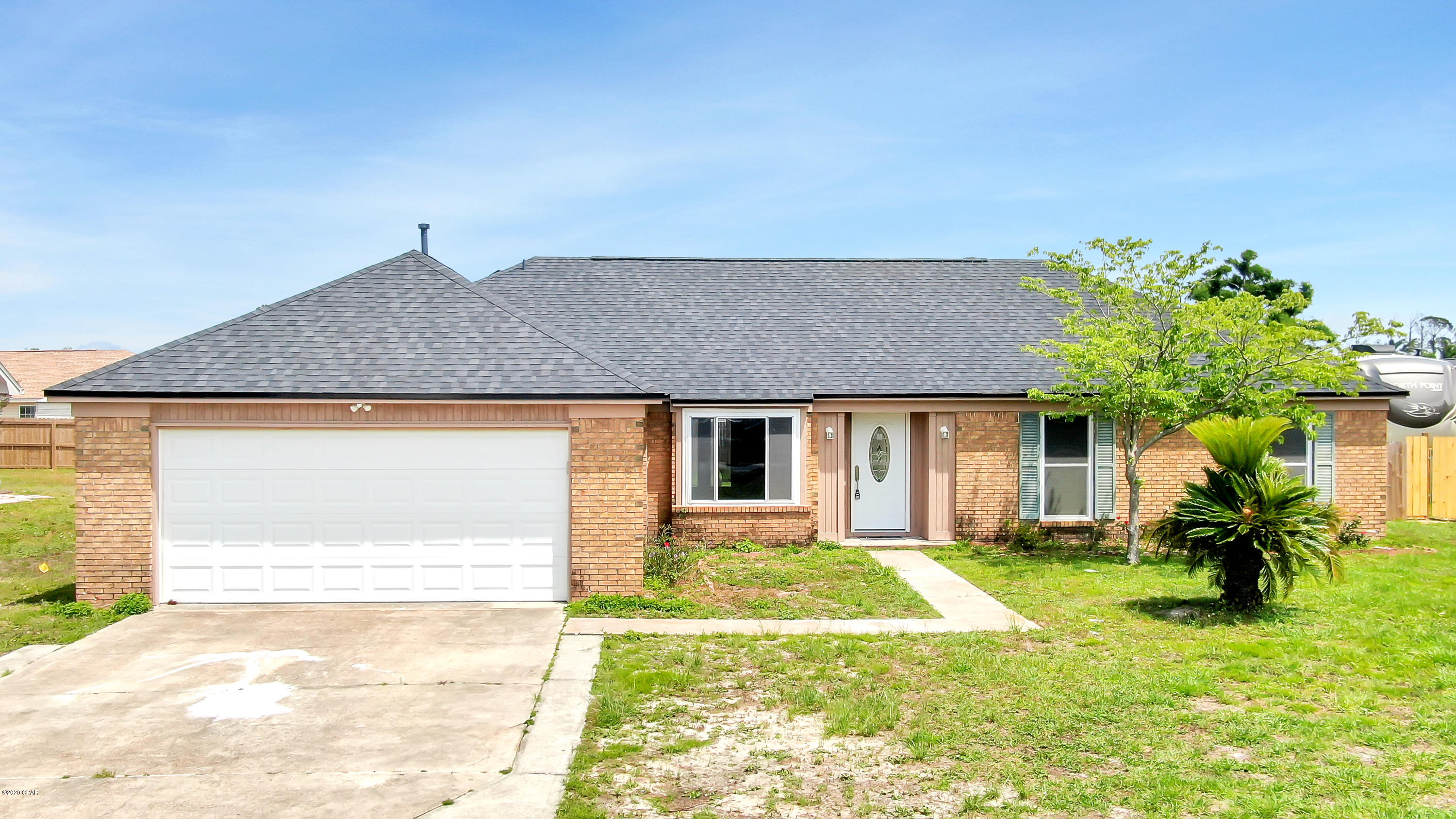 Beautiful renovated home within walking distance to the water at Callaway Bayou & the nearest boat landing just 1 mile away.  Close to Tyndall AFB, shopping, and schools.  Updates include wood grain ceramic tile throughout,  new roof, fresh paint,  new stove, microwave, and dishwasher.  Galley kitchen boasts  shaker style cabinetry and granite counter tops along with stainless steel appliances and breakfast bar.  Skylights bring in natural light in both bathrooms.  Relax under the covered patio of your privacy fenced backyard.  Water sprinkler system that is installed for front yard is on a well.    1 year home warranty offered for buyer.