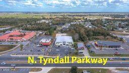 Free Standing 15,000 SF Building on 2 acre lot constructed New in 2020 after Hurricane Michael. Former Badcock Furniture Retail Outlet / Wide open with HVAC and full sprinkler system with large rear yard area