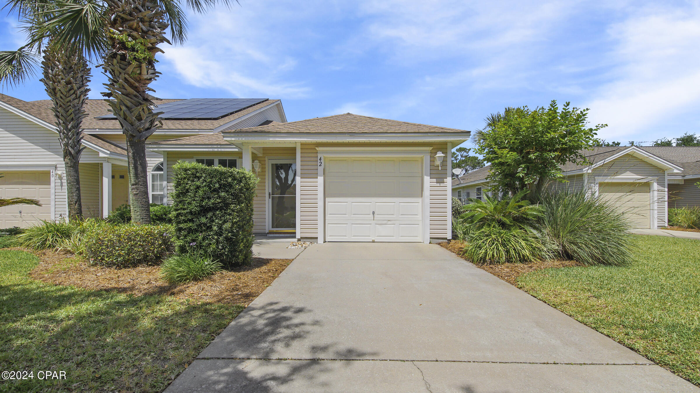 Available in mid-April! This pristine townhome is nestled in the charming community of Palmetto Trace, situated on the west end of Panama City Beach. Enjoy the amenities of this lovely neighborhood, including sidewalks, community pools, and its golf cart-friendly streets. Step inside to discover a spacious living room, two generous bedrooms, and two full bathrooms. The kitchen boasts ample cabinetry and countertop space, perfect for meal preparation. Plus, you'll appreciate the convenience of a full-size washer and dryer included with the townhome. Outside, unwind on the screened-in patio or take advantage of the green space just beyond. With a one-car garage, parking is a breeze. And don't forget, this pet-friendly property is just a short drive or golf cart ride away from Pier Park, dining, entertainment, and of course, the beautiful beach!
