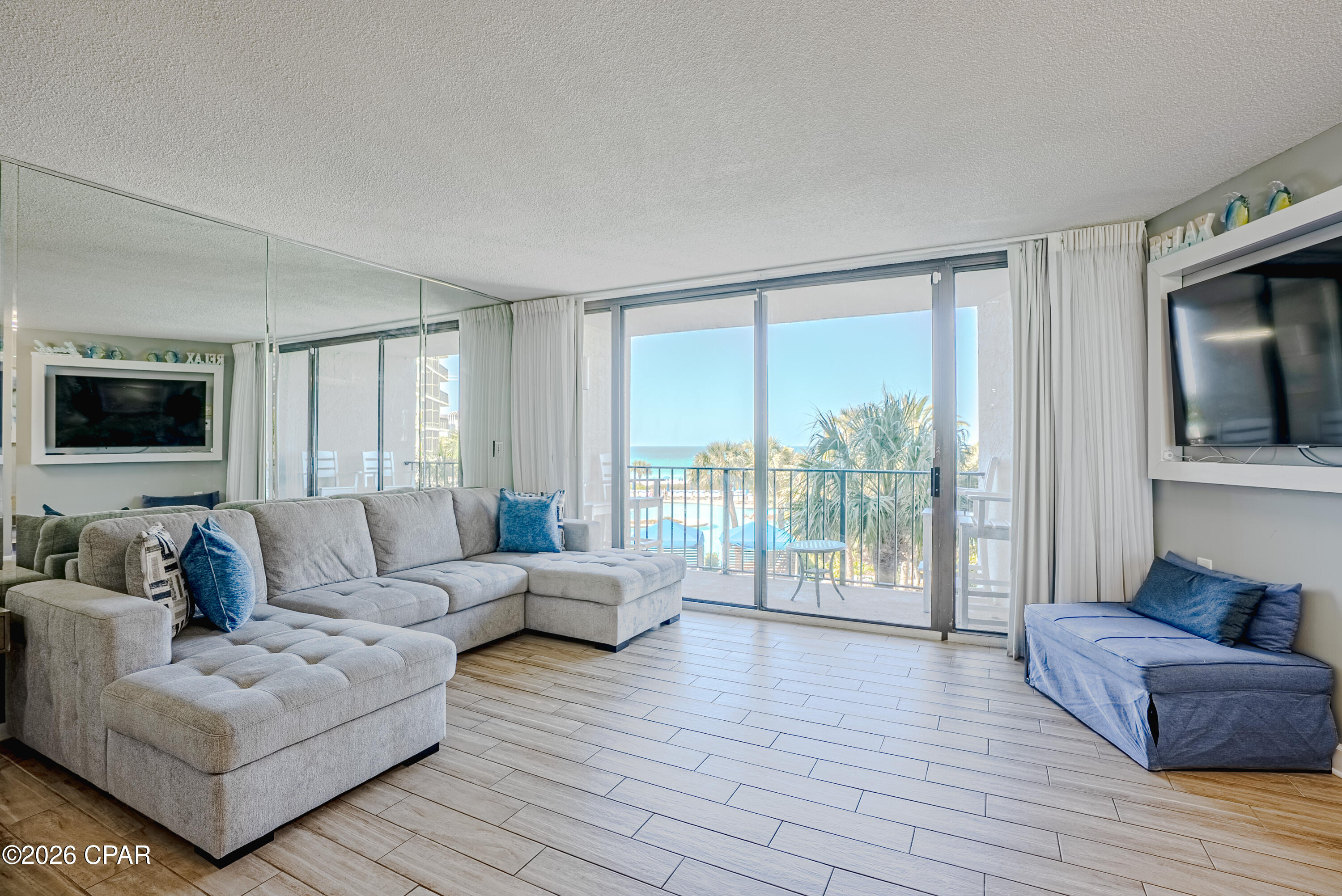 Gulf front 2 bedroom, 2 bathroom condo located in the highly sought after Tower I at Edgewater Beach and Golf Resort. Situated on the 2nd floor, this unit offers beautiful views of the lagoon style pool, tropical landscaping, and the Gulf, along with the relaxing sound of waves in the background.

Inside, tile plank flooring runs throughout, offering a clean look and easy maintenance. The kitchen features a granite breakfast bar that's perfect for quick meals, along with a separate dining nook that includes additional cabinetry for extra storage.

Both bedrooms are generously sized. The primary suite includes an ensuite bathroom with a soaking tub and shower combo. The guest bedroom has convenient access to a full bathroom, which can also be accessed from the hallway.

Updated HVAC system replaced approximately 2.5 years ago and the water heater was replaced approximately 3 years ago.

Edgewater Beach and Golf Resort is known for its impressive list of amenities including multiple pools, a fitness center, tennis and pickleball courts, a golf course, on site market, and a year round restaurant. The resort also offers direct beach access and gated parking on the same side of the street, so there's no need to deal with a parking garage.

Whether you're looking for a primary residence, second home, or investment property, this condo offers a great combination of comfort, location, and resort style living.