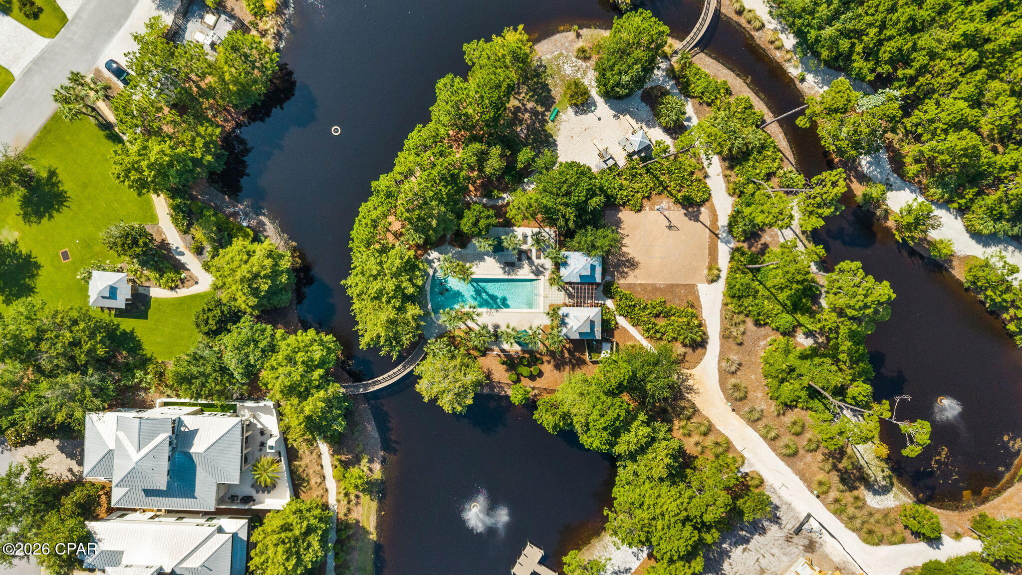 Panama City Beach is booming, making this a prime time to own in one of the area's most desirable gated communities. Located in Martinique on the coveted east end, this custom-built 4-bedroom, 5-bath coastal home is just minutes from the sugar-white sands and emerald waters of the Gulf.

Inside, you'll find an open-concept design with 10' ceilings, crown molding, a gourmet kitchen with granite countertops, stainless steel appliances, and a spacious living area with a fireplace. Two luxurious primary suites, each with spa-inspired baths, provide exceptional comfort, while every bedroom features its own private bath.

Your backyard is designed for relaxation with a private plunge pool, water feature, outdoor shower, and covered lanai. Recent improvements include a new upstairs HVAC system, oversized water heater with instant hot water recirculation, fresh exterior paint, new sod, impact-resistant windows, and a recently inspected roof.

Martinique offers walking trails, ponds, lush natural landscaping, and a community pool, all within walking distance of Grand Marlin, Captain Anderson's, J. Michael's, the marina, and the weekend farmers market.

With new attractions, continued investment, and rising demand fueling Panama City Beach's growth, homes in premier locations like Martinique are becoming increasingly difficult to find. Don't miss your opportunity to own a luxury coastal home in the heart of it all.