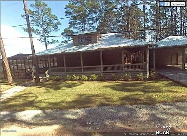 This is a must see 2,380 S.F 3 bedroom 3 bath water front home located on the intracoastal waterway with direct access to the Gulf of Mexico. Home Features 3 bedroom and 3 baths with a very comfortable open floor plan and vaulted tongue and grove knotty pine ceilings. Living room has a cozy stone gas fireplace with surround sound throughout living room, top of line appliances, ceramic tile throughout bathrooms .Bathrooms consist of separate tiled showers and bath. beautiful open beams throughout home and knotty pine floors. Walk out on the partial screened wraparound porch or enjoy the gas heated screened pool and hot tub. Automated outdoor mosquito misting systems. 8,000 pound boat lifts running water and electric . There is a covered 2 car carport that has a full bathroom that provides a extra little bonus for that outdoor life style This is water front living at its best .