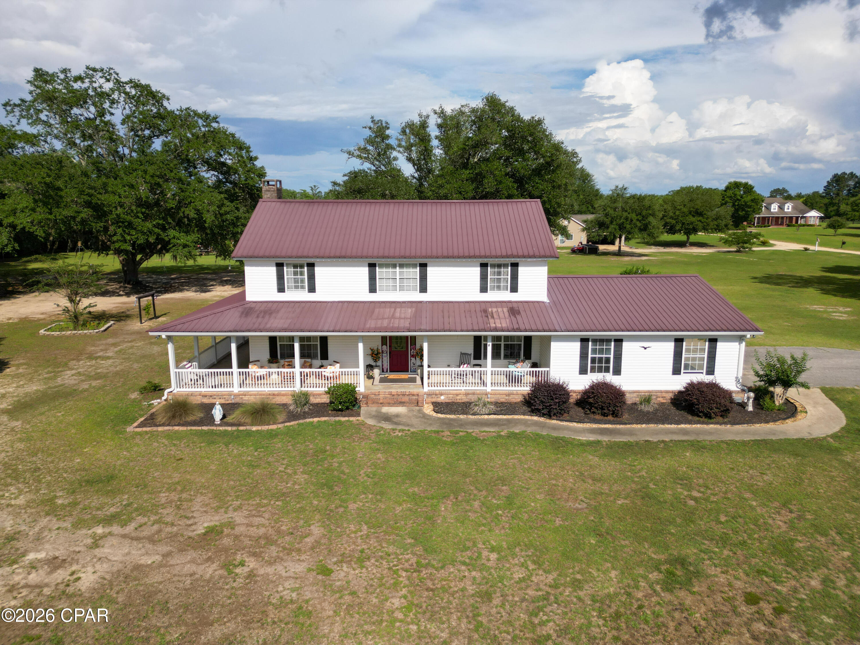 Escape to the beauty of country living with this charming two-story home nestled on beautiful acreage beneath majestic oak trees. A picturesque pond enhances the peaceful setting, creating the perfect backdrop for relaxing and enjoying nature.

Designed for both comfort and entertaining, this home features a welcoming wrap-around porch where you can drink sweet tea and overlook the pond and sprawling landscape, evening sunsets, and the gentle sounds of the countryside. Inside, spacious living areas offer plenty of room for family and guests, while large windows showcase scenic views of the surrounding property.

Step outside to a large patio, watch the sun rise while enjoy morning coffee.  This patio is ideal for hosting gatherings, grilling, or simply unwinding.    Whether you're enjoying the shade of the mature oaks, watching wildlife, or spending time with friends and family outdoors, this property offers a lifestyle that's hard to find.

With ample acreage for recreation, gardening, animals, or future expansion, the possibilities are endless. Combining privacy, natural beauty, and outdoor living at its finest, this exceptional property is ready to welcome you home.

Schedule your private showing today and discover the charm and tranquility this one-of-a-kind property has to offer.