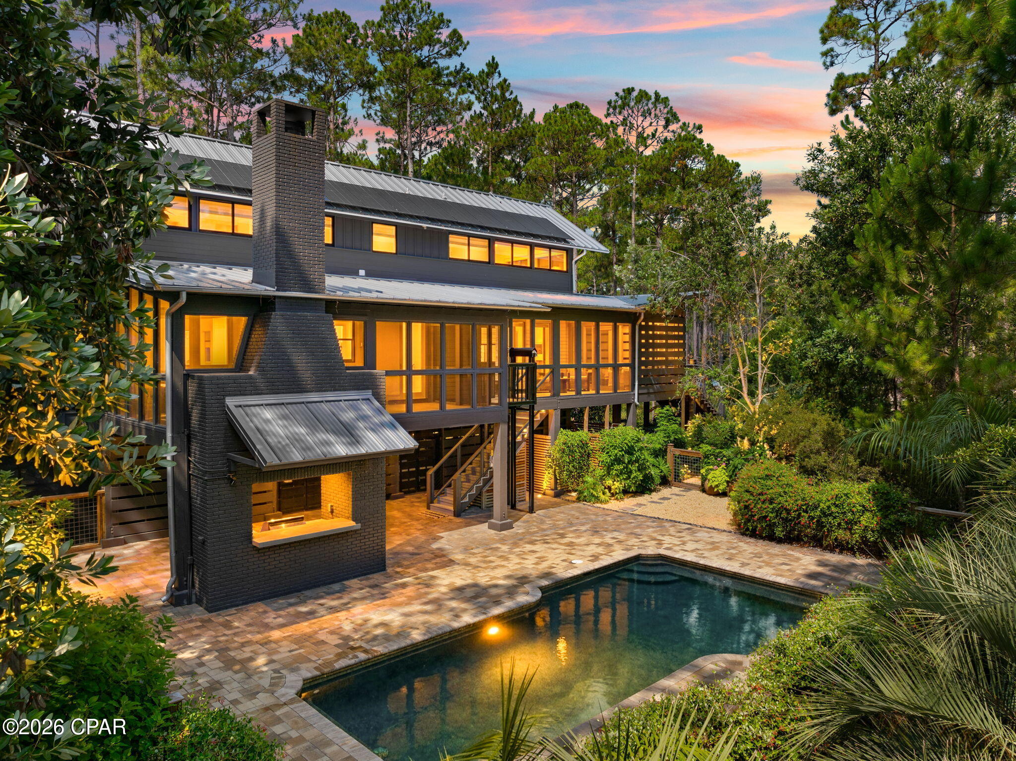 Stunning Southern Living home in the exclusive gated waterfront community of RiverCamps! Built in 2007, this beautifully updated 2,433-square-foot home offers 3 bedrooms, 3.5 bathrooms, and exceptional craftsmanship throughout. Situated on two lots totaling 1.95 acres with only one HOA fee, this rare property offers privacy, quality, and resort-style living.

Inside, you'll find hardwood floors throughout, tongue-and-groove walls and ceilings, custom built-ins, and timeless architectural details. Each of the three spacious bedrooms features a private en-suite bath, providing comfort and privacy for family and guests.

Recent updates include a new HVAC system, metal roof, appliances, water heater, washer and dryer, pool pump, solar system, and a private irrigation well. Enjoy peaceful pond views from more than 800 square feet of screened porches, a wood burning fireplace, relax by the private in-ground pool, and take advantage of the cargo lift for added convenience.
All appliances convey. Furnishings (except dining table and chairs) and new golf cart convey on acceptable offer.
Additional 2.27-acre Lot on the street is also available for $130,000 ensuring you the ultimate in privacy!

RiverCamps is a premier 1,500-acre gated waterfront community surrounded by West Bay, the Intracoastal Waterway, and Crooked Creek. With fewer than 450 homes planned, residents enjoy an unmatched blend of privacy and outdoor recreation, including a community pool, boat ramp with direct Gulf access via West Bay, day-use boat slips, more than seven miles of scenic trails and boardwalks, kayaking, boating, fishing, wildlife viewing, and golf cart-friendly streets. A new fitness center is currently under construction and is expected to be completed by the end of 2026.

Conveniently located just 10 miles from the sugar-white beaches of Panama City Beach and the shopping, dining, and entertainment at Pier Park, approximately 10 minutes from Northwest Florida Beaches International Airport, the new FSU Health hospital and medical campus, and only 2 miles from the new Publix and a planned 500,000-square-foot retail development, this home offers the perfect balance of peaceful coastal living and everyday convenience.

This is a rare opportunity to own one of RiverCamps' most distinctive homes in one of Northwest Florida's most sought-after waterfront communities. Close to everything yet far from the traffic and crowds!