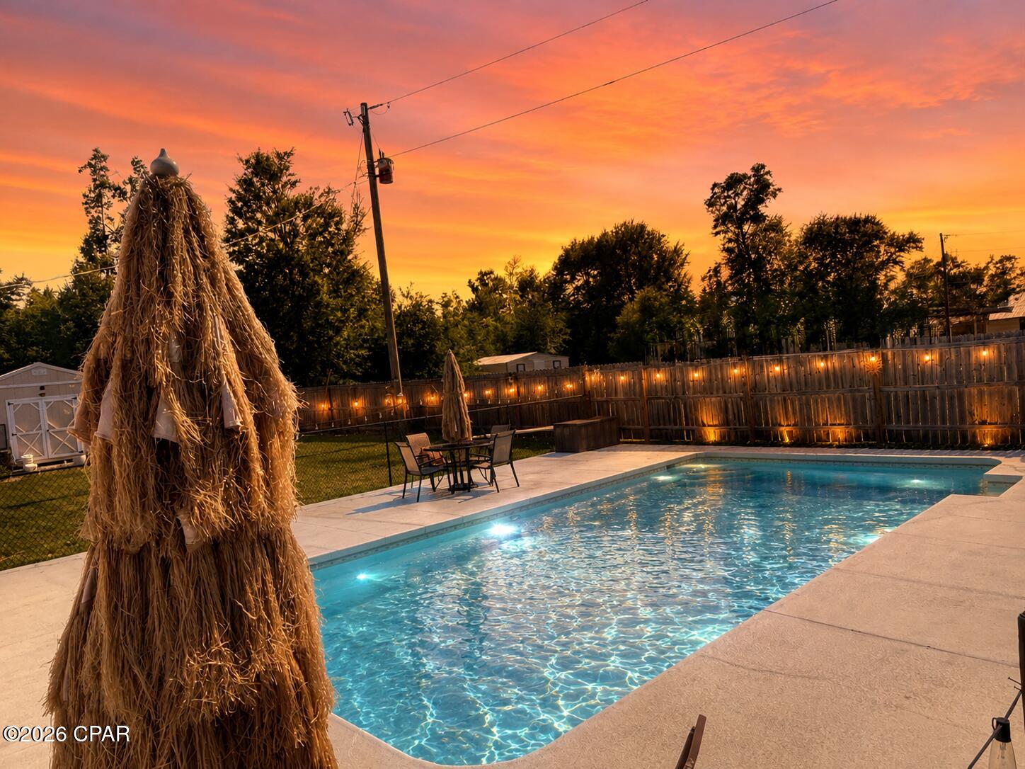 POOL HOME ON 2 ACRES WITH NO HOA! If you've been searching for the perfect combination of privacy, space, and convenience, this all-brick 3-bedroom, 2-bath home is ready to welcome you home. Located just off Highway 231 in Panama City, this move-in-ready property offers peaceful country living while remaining just minutes from shopping, dining, schools, and a short drive to Tyndall Air Force Base and the beautiful Gulf Coast beaches.

Inside, you'll find a warm and inviting floor plan featuring fresh interior paint, luxury vinyl plank flooring, a welcoming foyer with a coat closet, and a spacious living room showcasing beautiful wood-beamed ceilings and a cozy wood-burning fireplace. The kitchen offers stainless steel appliances, a breakfast nook perfect for casual dining, and easy access to the adjoining air-conditioned sunroom, providing additional year-round living space ideal for relaxing, entertaining, or enjoying views of the backyard. The home also features a separate laundry room, two linen closets, a tiled shower/tub combination, and a functional primary suite with a large walk-in closet.

Step outside to your own private backyard oasis featuring a large in-ground gunite pool, a covered screened patio, and a privacy fence surrounding the backyard, creating the perfect setting for entertaining or enjoying quiet evenings at home. The pool is professionally maintained by Tropical Pools & Spas, making ownership simple and convenient.

With two acres of land, there's plenty of room for all your hobbies, equipment, and outdoor toys. Two concrete parking pads provide ample space for RVs, boats, trailers, or additional vehicles, with one pad already equipped with electricity. A storage shed offers even more space for tools and lawn equipment.

This home also provides peace of mind with a brand-new septic system, a roof approximately six years old, an HVAC system approximately six years old, and a private well.

Whether you're looking for a pool home, acreage, RV parking, boat parking, no HOA restrictions, or simply more room to spread out while staying close to town, this property checks all the boxes and offers the lifestyle you've been searching for.