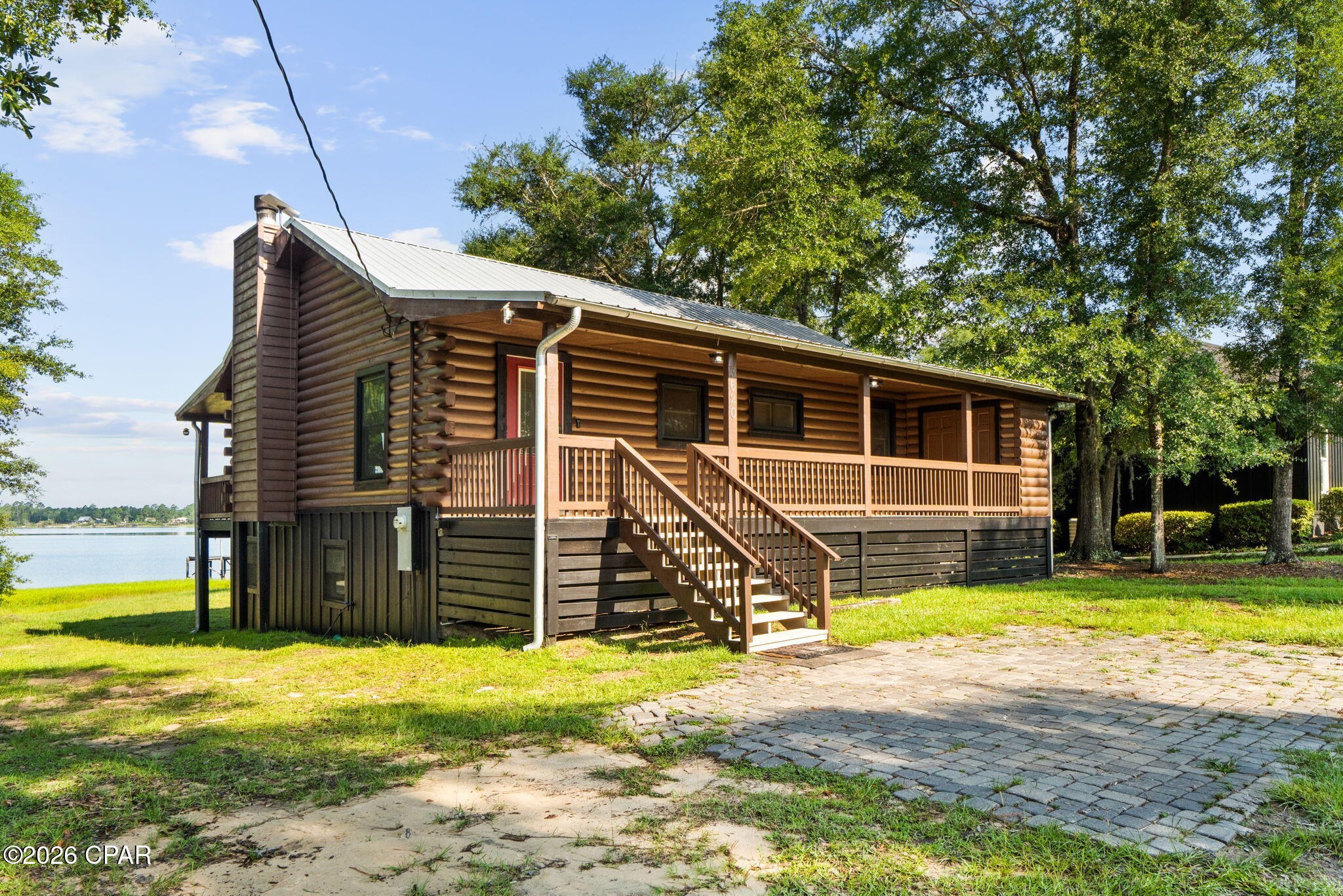 Wake up to breathtaking lake views and spend your evenings watching the sunset from the expansive covered porch at this beautifully updated log cabin retreat. Whether you're looking for a full-time waterfront home, a weekend getaway, or an income-producing investment property, this one checks all the boxes.

Offering 4 bedrooms, 3 full bathrooms, and over 2,100 heated and cooled square feet, the home features a spacious open-concept living area with soaring vaulted ceilings, warm wood finishes, and a stunning stone fireplace that creates the perfect gathering space. The remodeled kitchen is designed for both everyday living and entertaining with butcher block countertops, a farmhouse sink, pot filler, stainless steel appliances, and a large island overlooking the living room and lake.

The upstairs has been thoughtfully updated while the entire downstairs has been completely renovated with all-new electrical, plumbing, drywall, LVP flooring, paint, bathroom, appliances, and energy-efficient mini-split HVAC systems--creating the ideal space for guests, extended family, or rental potential. A Murphy bed in the guest room adds even more flexibility.

Outside, the lifestyle truly shines. Enjoy panoramic lake views from the oversized covered deck, launch a kayak, spend the day fishing, or simply relax and soak in the peaceful waterfront setting. A 12x32 workshop with power and window A/C provides plenty of room for hobbies, storage, or projects, while the freshly painted exterior, newly finished laundry room, owned Culligan water filtration system, and newer water heater and kitchen appliances add lasting value.

If you've been searching for a move-in ready waterfront property with character, modern updates, and endless possibilities, 3620 Seminole Lane is ready to welcome you home.

Additional highlights include a beautiful log cabin exterior with fresh paint, over 2,128 heated and cooled square feet, soaring vaulted ceilings, a wood-burning fireplace, and a fully remodeled kitchen complete with a farmhouse sink, pot filler, butcher block countertops, stainless steel appliances, and a large island. The expansive covered porch overlooks the lake, providing the perfect place to unwind while taking in the incredible waterfront views. The 12x32 workshop with electricity and window A/C adds exceptional versatility. The owned Culligan water filtration system, newer water heater, kitchen appliances less than five years old, and the completely renovated downstairs make this home truly move-in ready. Whether you're searching for a primary residence, a peaceful weekend retreat, or a short-term rental investment, this property offers an incredible opportunity to enjoy lakefront living at its best.