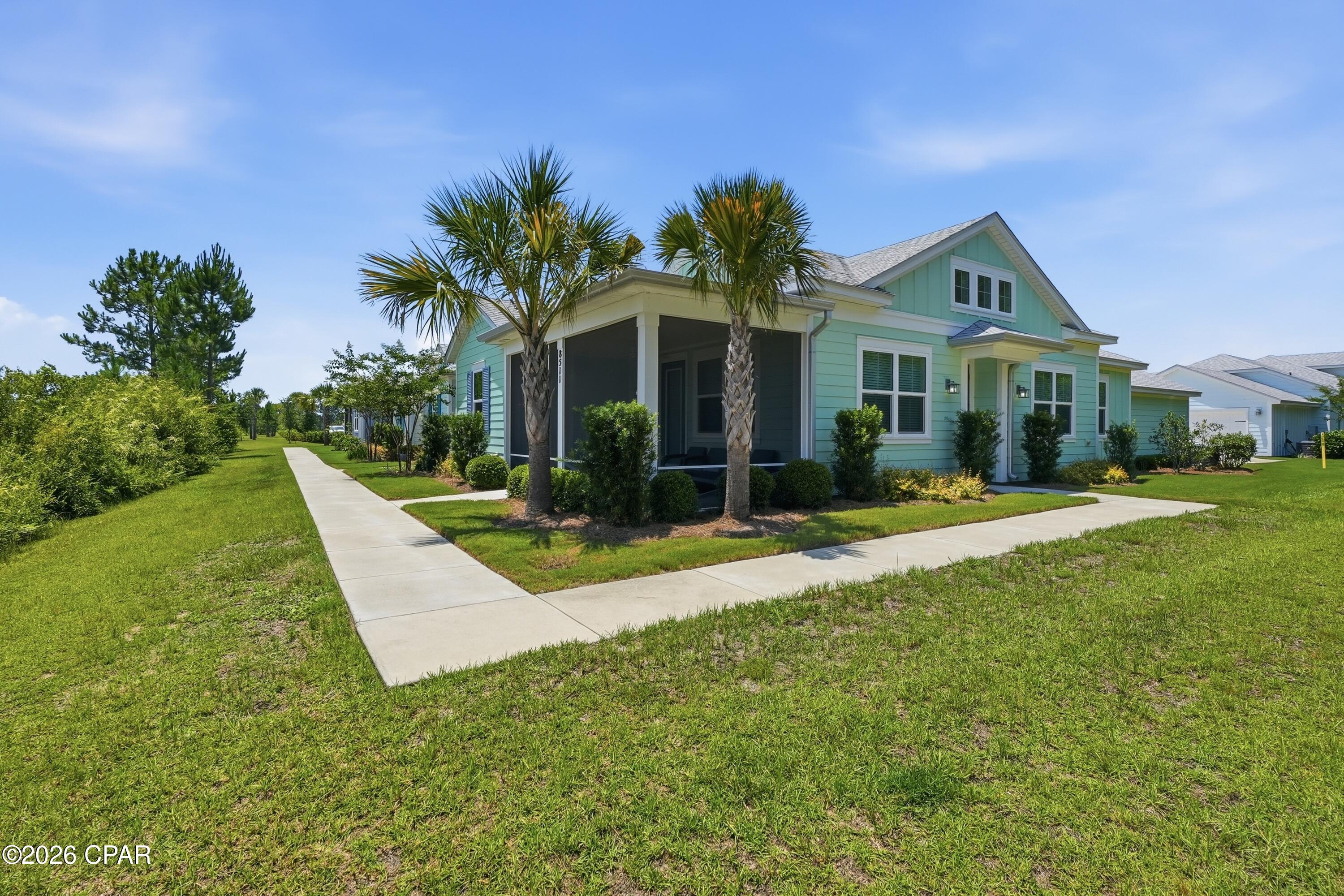 Amazing ALOHA on an AWESOME PRIVATE LOT! Experience coastal-inspired living in this beautifully maintained Aloha Cottage located in Latitude Margaritaville Watersound. Featuring two bedrooms plus a versatile den, this popular floor plan offers flexible living space and an open-concept design that blends comfort, functionality, and style. 

The standout feature of this home is its exceptional location. Situated with preserve space on both sides, it offers a level of privacy rarely found among cottage homes and creates a peaceful setting surrounded by natural beauty. Enjoy morning coffee or evening relaxation from the screened porch while taking in the tranquil preserve views. 

Inside, the spacious great room features vaulted ceilings and abundant natural light since you can keep the blinds open and still maintain privacy. The kitchen features a large center island, quartz countertops, upgraded cabinets, tile backsplash, and ample workspace for cooking and entertaining. A dedicated dining area provides the perfect setting for gatherings. The primary suite includes a generous walk-in closet, an ensuite bath with dual vanities, and a tiled walk-in shower. On the other side of the home, the guest bedroom and full bath provide spacious accommodations. The den offers endless possibilities as a home office, hobby room, media room, or additional guest space. Quality finishes throughout include Mohawk RevWood flooring in the main living areas, tile in wet areas, custom ceiling fans, and thoughtful design upgrades. 

Beyond the home, residents enjoy access to an impressive collection of resort-style amenities, including a waterfront pool, restaurant, fitness center, indoor lap pool, spa, pickleball and tennis courts, kayaking, bocce ball, cornhole, live entertainment, and a full calendar of social activities. Additional shopping, dining, medical, and marina offerings are planned for the surrounding area, adding even more convenience and lifestyle opportunities. 

Located just minutes from the Emerald Coast's renowned white-sand beaches, this home combines a private preserve setting with easy access to everything the area has to offer. HOA-maintained lawn care and scheduled exterior maintenance provide a low-maintenance lifestyle, allowing more time to enjoy the community and coastal surroundings. 

Opportunities to own an Aloha Cottage with this level of privacy are uncommon. Come discover what makes this homesite one of the most desirable cottage locations in the Active 55+ community of Latitude Margaritaville Watersound!