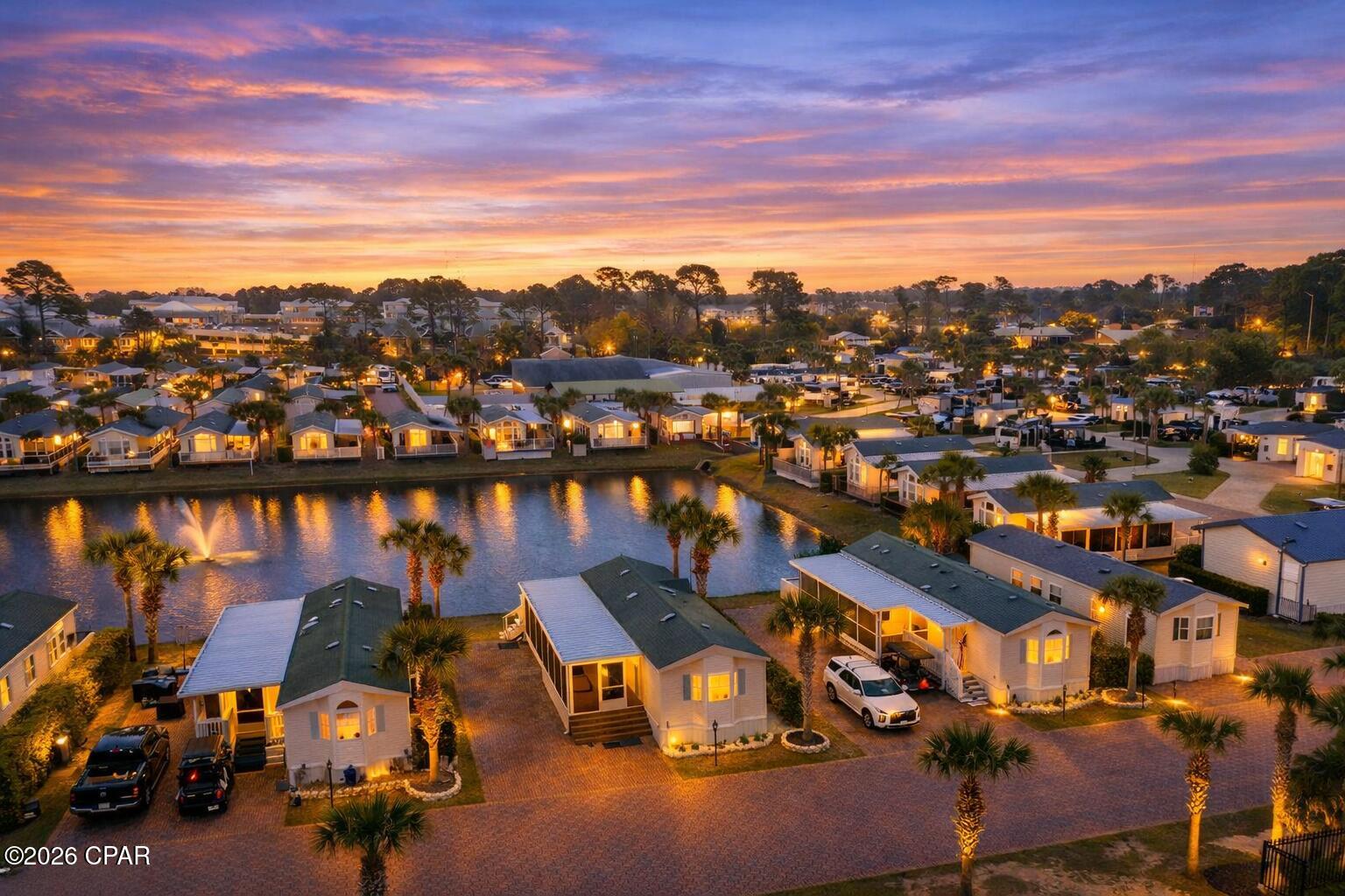 Incredible opportunity to own a waterfront home in Sun Outdoors, a resort-style community known for its extensive amenities and vibrant coastal lifestyle.
This well-maintained 2014-built home comes fully furnished and offers beautiful pond-front views of Turtle Pond, where you can enjoy watching the many turtles and fish that inhabit the peaceful waterway. The screw-down porch spans the full length of the home and wraps around toward the pond, creating the perfect place to relax and take in the serene setting.

Recent updates include new flooring throughout, a new tiled shower, a new A/C (2023), a new refrigerator, fresh interior and exterior paint, and a new GE washer/dryer combo, making this property truly move-in or rental ready.

As an added bonus, the home sits on a double lot, which includes a dedicated RV spot with hookups. This provides a fantastic income-producing opportunity, allowing you to rent both the home and the RV space separately.

Residents of Sun Outdoors enjoy an impressive list of amenities including two heated pools, a hot tub, fitness center, clubhouse, two fishing ponds, pickleball courts, sand volleyball, basketball court, shuffleboard, horseshoes, fire pit area, two dog parks, dog wash station, and a playground.
The monthly lot fee of $1,317 (for both lots) covers a wide range of services including community amenities, common area maintenance, water, sewer, cable, WiFi, daily trash pickup, and lawn maintenance. Another unique benefit is no property taxes and no traditional closing costs associated with the home.

Whether you're looking for a vacation getaway, full-time residence, or income-producing property, this waterfront retreat offers exceptional value and lifestyle in one of the area's most amenity-rich communities.