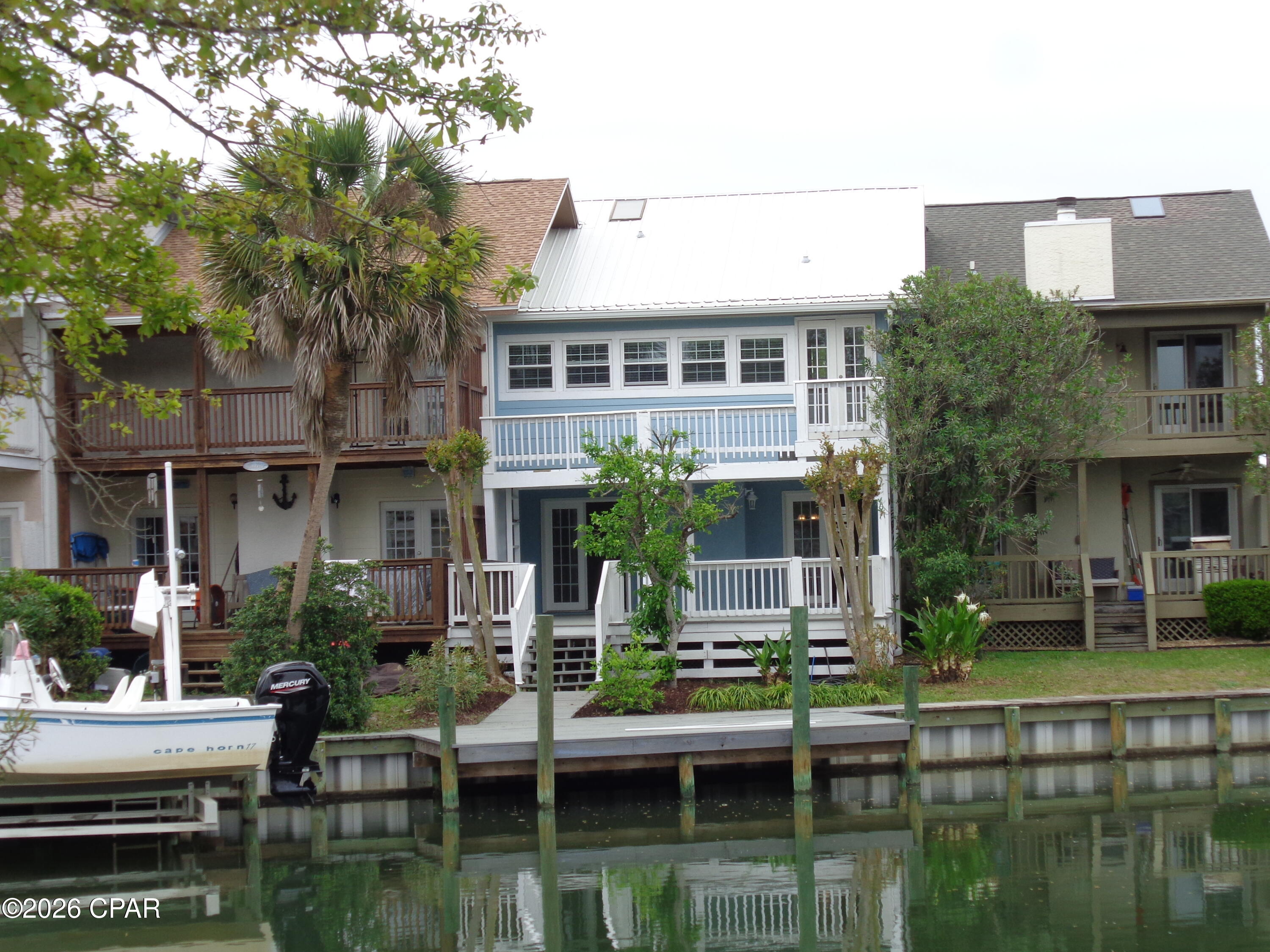 REDUCED --  REDUCED  --IMMACULATE - UPDATED - SPACIOUS   
THIS SPECIAL TOWNHOME OPENS TO A LARGE GREATROOM WITH AN UNBELIEVABLE WATERFRONT VIEW.   RECENTLY UPDATED  KITCHEN HAS GRANITE COUNTERTOPS.  THE LARGE ISLAND ALSO HAS SMALLER PORTABLE ISLAND FOR ADDED COUNTER SPACE AND STORAGE. CLOSET/LAUNDRY IN THE HALL AND A PANTRY OFFER  EXTRA STORAGE( LAUNDRY HOOKUP IN GARAGE ALSO). A HALF BATH IS LOCATED ON THE MAIN FLOOR ALSO. TONGUE AND GROOVE CEILINGS THROUGHOUT THE HOME OFFER ADDED INTEREST WHILE A COMBO OF TILE AND BEAUTIFUL LUXURY VINYL FLOORS OFFER DURABILITY AND EASY OF CLEANING. 
UPSTAIRS:
OVERSIZE MASTER BEDROOM THAT OVERLOOKS THE CANAL OUT BACK HAS 2 SEPARATE CLOSETS (ONE IS A WALKIN) AND A LARGE NEWLY UPDATED TILE SHOWER WITH A SEPARATE TOILET AREA. TWO OTHER ROOMY BEDROOMS SHARE A HALL BATH.  THE LIST GOES ON ! 
 THE 22'X22' COVERED DECK/ PATIO OVERLOOKS THE CANAL WITH AN UPDATED SEAWALL AND 21' X 10' DECK JUST WAITING FOR YOUR BOAT. SEVERAL STREETS HAVE BEEN NEWLY PAVED WITH NEW CURBS, GUTTERS, FIRE HYDRANTS, AND WATER AND SEWER LINES. LOTS  OF AMENITIES TO SEE AND ENJOY. THIS HOME HAS BEEN ALMOST TOTALLY UPDATED! THIS IS A RARE FIND AND BEING ON THE WATER REALLY LETS YOU PLAY A LITTLE.
CALL TODAY FOR AN APPOINTMENT. !!!