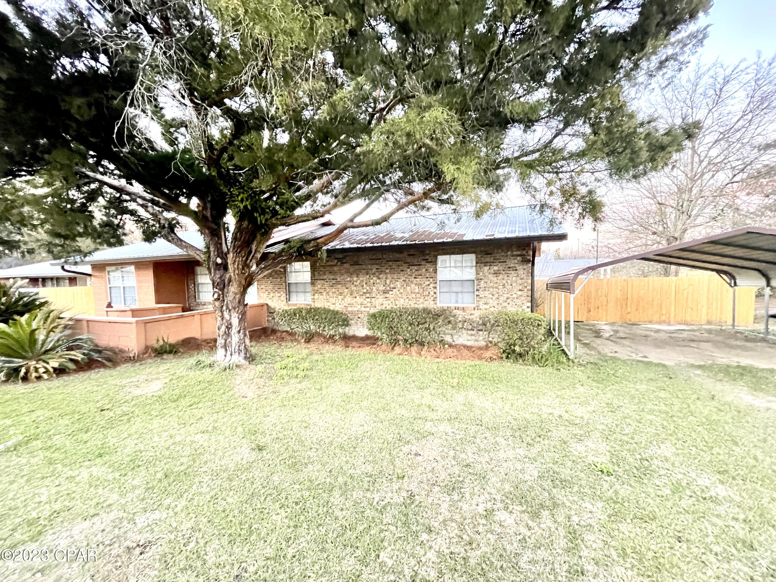 Wonderful home! Less than 60 miles from Panama City Beach, Florida.  
Less than 60 miles from Ft. Rucker, AL 
Nice brick home with newly renovated cabinets, granite countertops, flooring, a galvalume metal roof  and new fencing that encloses the back yard area.  It is a 3BR  2BA home that is over 1800 sq. ft. Walk onto your 14 x 32 deck from your back door and enjoy the Florida sunshine and grilling with your family and friends. You have access to high speed internet! This home is a must see. Call for a showing today.
