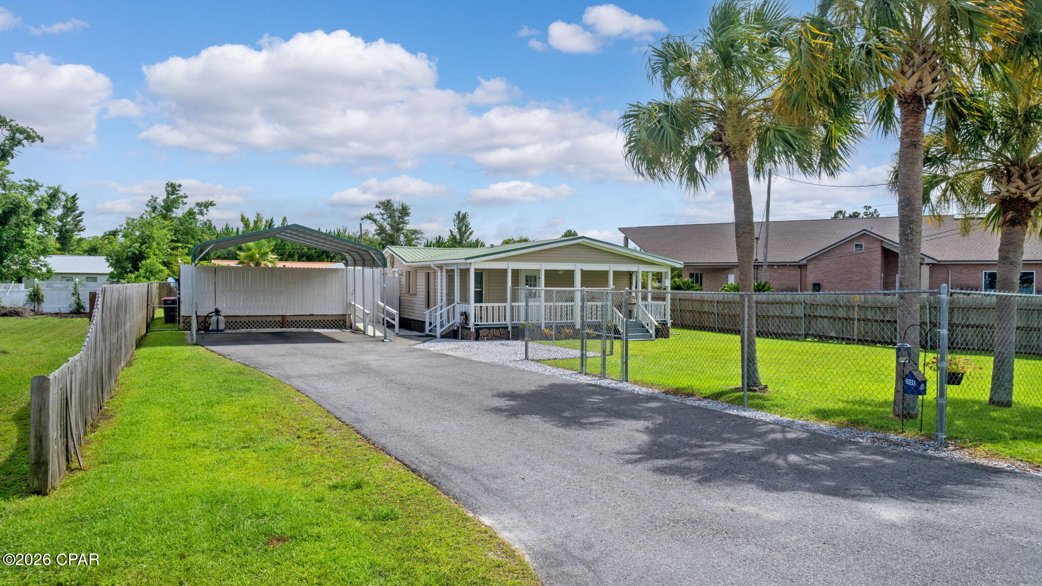 Welcome home to this beautifully updated 3-bedroom, 2-bath residence situated on a spacious quarter-acre lot. From the moment you arrive, you'll appreciate the paved driveway, 18x21 durable steel/metal carport, and fully fenced front and backyard, providing plenty of space for vehicles, pets, and play. Two storage sheds 12x10 and 12x8 with electricity offer endless possibilities for a workshop or additional storage. For added peace of mind, the home also comes equipped with hurricane shutters.
Step outside to you own private backyard retreat featuring a spacious deck, above-ground pool, and relaxing Jacuzzi- the perfect setting for entertaining family or friends or unwinding after a long day. Inside you will find numerous updates throughout the home, including new flooring, fresh interior paint, new kitchen countertops, sink and faucet, stainless steel appliances and new Samsung washer and dryer conveying. New bathroom vanities just installed last month. Durable Metal roof provides added peace of mind, new Heyward Sand filter just replaced on pool, all pool equipment will convey. Spacious rooms, primary suite has walk-in closet. Don't miss out on this opportunity to own a charming and affordable home in the city.
