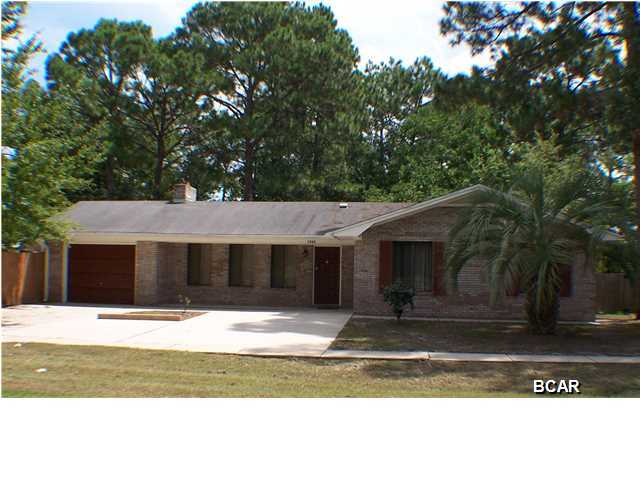 Close to shopping, schools and recreational facilities! Attractive 3 bedroom, 2 bath brick home with stainless steel appliances, screened-in pool and large backyard. Low maintenance home with single car garage, fireplace, yard building and screened area for tools and lawn equipment. New stove and other appliances are like new; laminate flooring throughout.