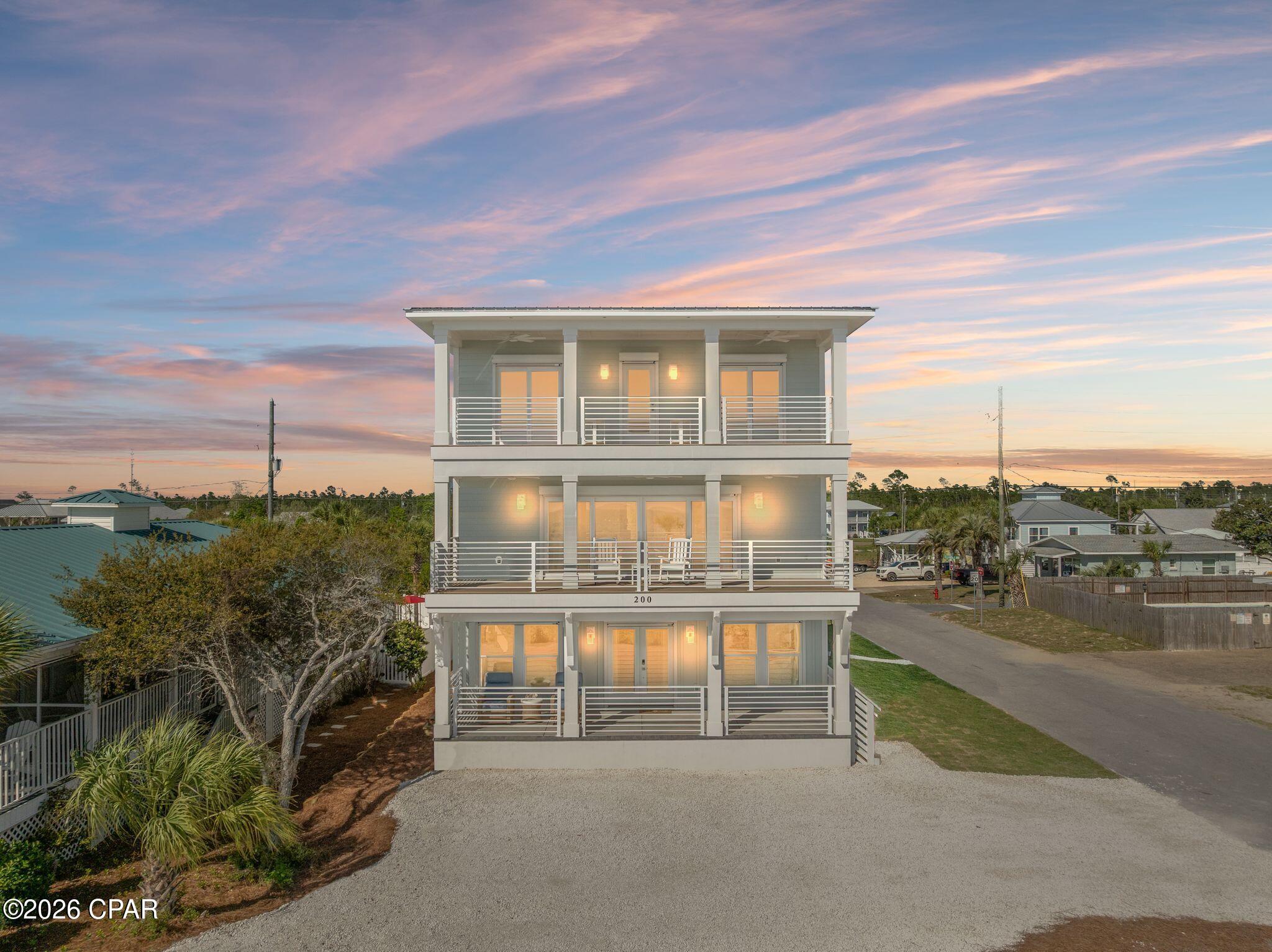 Experience elevated coastal living in this brand-new Gulf-facing home in the heart of Mexico Beach. Perfectly positioned this newly constructed residence offers unobstructed water views, expansive covered porches, and seamless indoor-outdoor living. The beachfront directly across is city-owned and dedicated as undevelopable, preserving long-term view corridors. Inside, you'll find a bright, open-concept floor plan with soaring ceilings, abundant natural light, and wide-plank wood flooring throughout. The spacious living and dining areas flow effortlessly into a chef's kitchen featuring quartz countertops, custom cabinetry, stainless steel appliances, a gas range, and a large island designed for gathering. This exceptional home features 8 spacious bedrooms--each with its own private en-suite bath, delivering unmatched comfort, privacy, and rental flexibility. The primary suite is a true retreat with private balcony access and breathtaking Gulf views, complemented by a spa-like bath with a walk-in shower. Step outside to enjoy your private pool and hot tub, creating a true resort-style setting just steps from the beach. Multiple covered balconies offer ideal spaces for morning coffee, sunset views, and coastal breezes, while the outdoor shower adds convenience after a day on the sand. Designed for both luxury living and strong income potential, the generous layout comfortably accommodates large groups. No flood insurance required. Strong short-term rental potential with high occupancy appeal due to bedroom count, en-suite layout, and proximity to the beach. With its prime location, protected Gulf views, rare 8 en-suite bedroom design, and resort-style amenities, this home offers space, style, and exceptional investment potential in one of Florida's most desirable coastal communities.