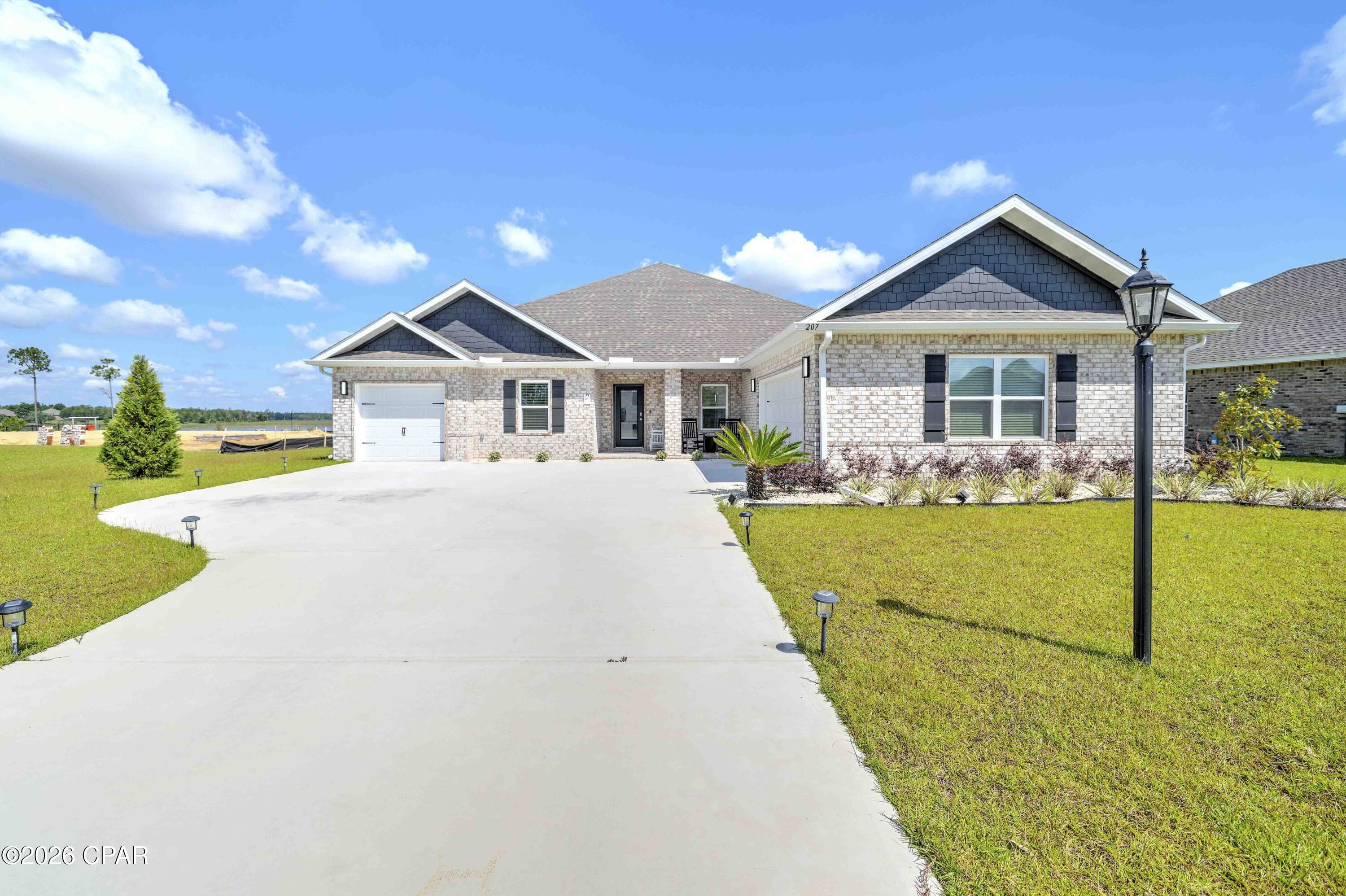 Welcome to this STUNNING, thoughtfully designed, ALMOST NEW HOME in one of Panama City's most sought-after communities.

This beautifully UPGRADED residence combines modern luxury with everyday functionality. It has FABULOUS tile flooring, enhanced lighting fixtures, designer ceiling fans throughout, upgraded front porch lighting, custom blinds, and a spacious screened-in porch perfect for enjoying Florida's year-round outdoor living.

The kitchen and living areas are designed for both entertaining and daily comfort. Upgrades add tremendous value, including; farmhouse sink, a whole-home water softener and filtration system, full gutter system surrounding the home, and storage racks in the garage. Added bonus, golf cart is included with an acceptable offer, and the furniture is negotiable.

Lake Merial is known for its breathtaking 300-acre spring-fed lake, ideal for kayaking, paddleboarding, and fishing, along with scenic walking trails, green spaces, and a vibrant calendar of community events. From festive holiday celebrations to food truck nights and golf cart-friendly streets, this neighborhood offers a lifestyle that is both relaxed and engaging!! Call your favorite Realtor to see this one, it is PERFECT!! All measurements to be verified by the buyer.