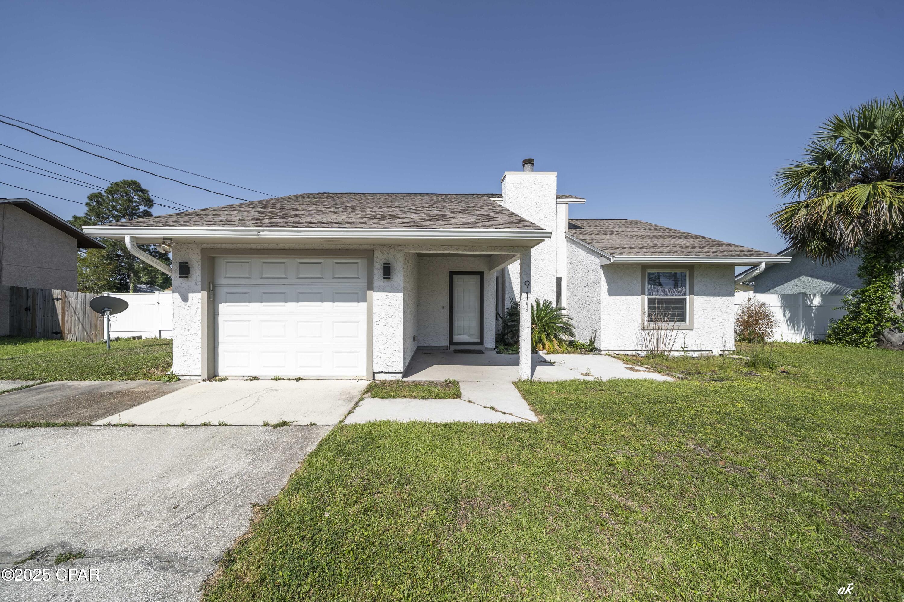 UNDER CONTRACT WITH CONTINGENCIES; SELLER ACCEPTING BACKUP OFFERS.

VA assumable loan 5.375% interest.
COMPLETELY REMODELED HOME. 

Stunning 3-Bedroom Home in Prime Panama City Beach Location

Welcome to your dream home in one of Panama City Beach's most sought-after private communities! This beautifully updated 3-bedroom, 2-bathroom home offers over 1,500 sq. ft. of thoughtfully designed living space, making it the perfect retreat for relaxation or entertainment. Ideally situated near Pier Park, top-rated Bay County schools, world-class shopping and dining, and, of course, the breathtaking white sandy beaches, this home delivers both luxury and convenience.

From the moment you arrive, the freshly painted exterior and beautifully landscaped yard set the tone for the quality and care that defines this property. Step inside to discover brand-new porcelain tile flooring throughout, elegant, canned lighting in the great room and master bedroom, and a spacious Florida room with brand-new windows, fully heated and cooled for year-round comfort.

The great room is truly a showstopper, featuring raised ceilings, a stunning shiplap accent wall, and a wood-burning fireplace, creating a warm yet sophisticated ambiance. The sleek, upgraded kitchen is a chef's delight, complete with new stainless-steel appliances, granite countertops, a stylish tiled backsplash, and a generous pantry.

The master suite offers an incredible retreat with ample space, a huge walk-in closet, and an en-suite bathroom featuring a tiled tub/shower. The additional bedrooms, located on the opposite side of the home for privacy, provide spacious closets and versatile space for family or guests. The second bathroom has been tastefully updated with modern tile flooring and a tiled shower.

Designed for effortless living, the laundry room flows seamlessly into the garage, adding to the home's practical charm. Outside, the private, fully fenced backyard is perfect for hosting gatherings, summer BBQs, or simply unwinding in your personal oasis.

Additional upgrades include:
... New roof
... New AC unit (installed within the last 2 years)
... New water heater (installed within the last 2 years)
... New exterior paint
... Vinyl Privacy Fence

This home is truly move-in ready and a must-see! Don't miss your opportunity to own this incredible property in one of Panama City Beach's most desirable locations. Call today to schedule your private showing!