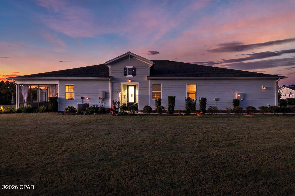 Located in Latitude Margaritaville Watersound phase 3C which means very minimal traffic.. This beautiful ANTIGUA model sits on a large corner lot that offers an open and functional floor plan designed for comfortable coastal living. The home features a spacious great room that flows into the kitchen and dining area, providing an ideal layout for everyday living and entertaining. The kitchen includes a large island, ample cabinetry, and modern finishes. Lots of upgrades including crown molding throughout the entire home. The primary suite offers a private retreat with a walk-in closet and an en-suite bath. A secondary bedroom and full bath provide space for guests, while an additional flex area may be used as an office, den, or hobby room. Outdoor living is enhanced by a covered/screened lanai, and the attached garage provides additional storage. There is sufficient floored attic space for storage. Latitude Margaritaville Watersound is a gated 55+ community offering resort-style amenities, including pools, fitness facilities, pickleball and tennis courts, walking trails, dining options, and a full calendar of social activities. Conveniently located near Scenic Highway 30A, beaches, shopping, dining, and medical facilities. The airport is a very short drive away and the new Marina is under construction.The town center amenities include the Latitude Bar and Chill, Outdoor Resort Style Pool, Indoor lap pool and Spa, Fitness Center, Pickleball, Tennis, Bocce Ball, Cornhole, brand new Woodworking Shop, Pottery center and Movie Theater ! Enjoy live music at the Bandstand and Game Lawn or take a kayak on the Intercostal Waterway. All of this just a short drive to the beautiful Emerald Coast Beaches where you can enjoy breathtaking sunsets on the white sugar sand beaches! PUBLIX is under construction for your convenient shopping. Buyer to verify all information deemed important.