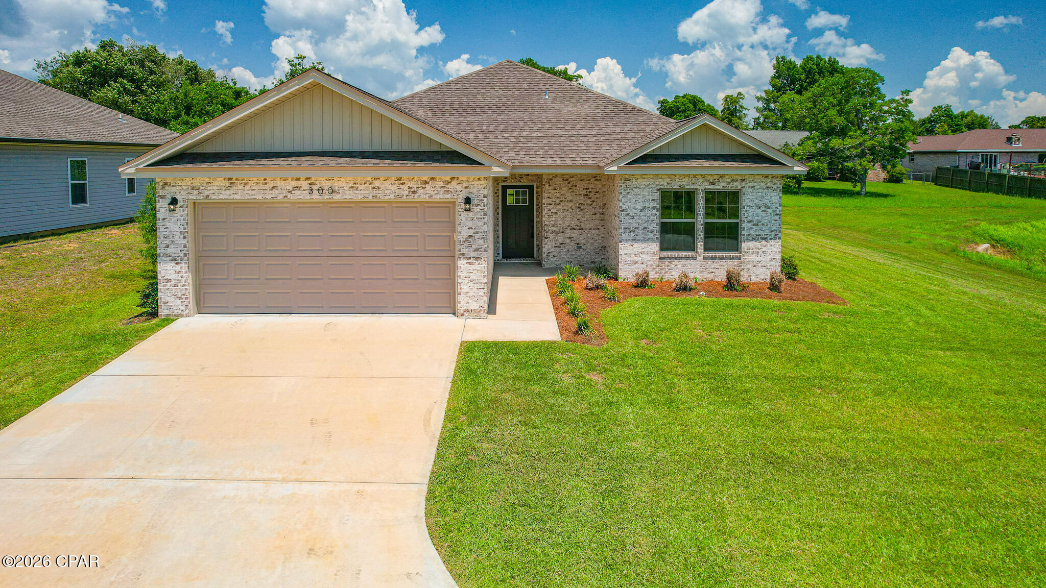 Savor stunning panoramic views of Callaway Bayou and the tranquility of waterfront-inspired living without the higher price tag of a true waterfront property. This newly constructed 3 bedroom, 2 bath custom built home masterfully blends modern elegance with a peaceful coastal vibe, delivering breathtaking views from an elevated vantage point above Callaway Bayou.

The split-floor plan is designed for maximum privacy, which is divided by an open-concept living area that flows into a large kitchen & dining area, filled with elegant crown-molding, white shaker cabinets, quartz countertops, premium stainless-steel appliances, pantry closet, and plenty of natural light flooding in from every room in the house. This home is thoughtfully retrofitted with universal remotes in every room, providing seamless, one-touch control of all lighting and ceiling fans throughout the entire house. Whether you're setting the perfect ambiance for movie night, brightening the space for morning routines, or creating a relaxing evening breeze, these convenient controls make daily living effortless and enjoyable. The home also features upgraded hydraulic soft-close dampeners on all cabinets and drawers. These provide a smooth and quiet close that reduces noise, prevents pinched fingers, and extends the lifespan of the cabinets and fixtures by eliminating forceful impacts.

The thoughtfully placed primary suite creates a true private oasis with a spa-inspired ensuite bathroom, featuring a double quartz vanity with undermount sinks, a spacious frameless-glass walk-in shower lined in floor-to-ceiling designer tile, and a deep garden soaking tub perfect for unwinding. Another convenient feature is the large walk-in closet on the back side of the ensuite bathroom, creating effortless convenience and seamless flow.

On the opposite wing, there are two additional rooms with an abundance of natural light and versatile space, perfect for a home office, gym, nursery, or additional bedrooms. One features an additional walk-in closet for extra storage space, while the other includes a charming closet with French-style doors. A conveniently located hall bath serves the area with a sleek quartz-topped single vanity, shower/tub combination, and a large linen closet just across the hall. 

This home is located just minutes away from Tyndall Air Force Base, top-rated local schools, a variety of excellent restaurants, and convenient shopping, offering the ideal blend of prime accessibility and effortless lifestyle conveniences. This home reflects attention to every detail, with uncompromising quality and meticulous craftsmanship throughout. So if you're seeking a brand-new custom built home, then don't miss this opportunity!
