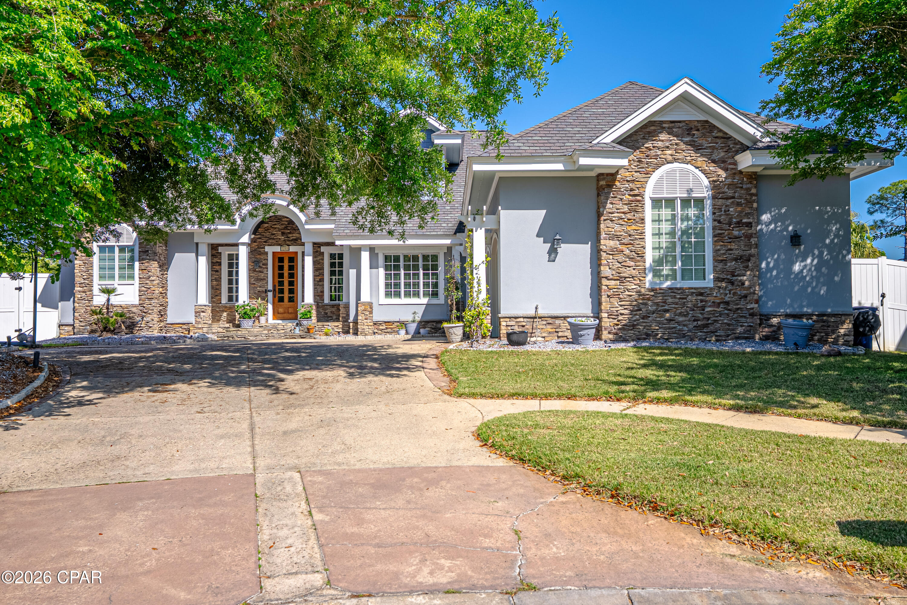 OPEN HOUSE SAT, 4/25 11am-2pm, SUN 4/26 12pm-3pm
Welcome to this exceptional custom home, built by a renowned local builder and proudly featured as a Parade of Homes showcase property. Prepare to be captivated by its distinctive architecture, thoughtful details, and undeniable charm.
This remarkable residence offers breathtaking marsh views that serve as a serene, ever-changing backdrop for everyday living and unforgettable entertaining. Nestled beside the sparkling pool and spa, the sweeping marsh vista invites you to unwind while watching tall grasses sway gently in the breeze and birds glide gracefully overhead -- pure Florida tranquility at its finest.
Step inside through the elegant beveled-glass front door and be greeted by the rich warmth of Australian cypress hardwood flooring that flows throughout the main living areas. The thoughtfully designed open-concept layout with 10ft ceilings seamlessly connects the living, dining, and kitchen spaces, creating a warm and inviting atmosphere perfect for both relaxed family nights and lively gatherings.
The master suite is a true private retreat, complete with his-and-hers closets, with hers beautifully lined in fragrant cedar. The newly renovated master bath from 2024 features dual vanities with granite countertops, a spacious walk-in shower, and a luxurious standalone soaker tub -- your personal daily spa experience.
The chef's kitchen, fully renovated in 2025, is a standout highlight with premium appliances including a Wolf range, a European-style custom hood, and a top-of-the-line smart refrigerator. Additional luxuries include a convenient pot filler, a warming drawer, a generous quartz waterfall island, and a butler's pantry with a second refrigerator and desk. The adjacent laundry room adds everyday convenience.
Upstairs, you'll discover a versatile media area, mother-in-law suite, or apartment featuring built-in cabinetry and a full wet bar with beverage cooler, microwave, and sink. An adjoining bedroom and full bathroom offer flexibility, easily used as a guest suite, private office, or even a home gym thanks to the reinforced flooring and mirrored wall. Both rooms were updated with LVP flooring for the bedroom and durable, pet- and stain-resistant carpet in the spacious living area.
Outside, the resort-style backyard is an entertainer's dream. Enjoy the saltwater heated pool with raised spa, soothing stone waterfall, and brand-new screen enclosure. The area is finished with fresh pavers, Trex decking around the spa, and a built in Big Green Egg and a natural gas grill -- perfect for year-round outdoor cooking and gatherings.
Additional premium features include an oversized two-car garage that comfortably fits two full-size vehicles, an oversized golf cart, plus two large storage closets. A Versa-Lift dumbwaiter in the garage provides effortless access to expansive attic storage for all those holiday decor items. The house is also insulated with Icynene spray foam for superior energy efficiency and comfort throughout, while sound-insulated interior walls ensure exceptional privacy and quiet. The home is equipped with surround sound speakers indoors and outdoors for immersive audio wherever you are.
This is more than a home -- it's a lifestyle. Exceptional craftsmanship meets thoughtful luxury in a setting that feels like a private resort.
Don't miss your chance to own this one-of-a-kind custom masterpiece. Schedule your private showing today and experience the magic in person.
All sizes, measurements, and details are approximate. Buyers are encouraged to verify all information independently.