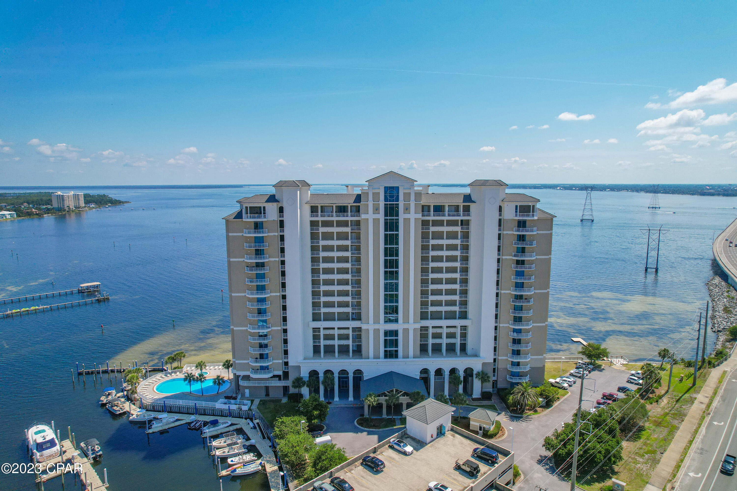MOTIVATED SELLER -BRING OFFERS! Experience elevated coastal living in this exquisite 3-bedroom, 3-bathroom Bayfront residence offering breathtaking panoramic views of St. Andrews Bay. Thoughtfully designed to capture the beauty of the water from nearly every vantage point, this exceptional condo features an expansive private balcony--an ideal setting for entertaining, relaxing with a glass of wine, or enjoying unforgettable sunsets overlooking the bay.

Inside, the light-filled open-concept layout showcases refined finishes and spacious living areas designed for both comfort and style. Floor-to-ceiling sliding glass doors frame the water views and open seamlessly to the oversized balcony, creating a true indoor-outdoor living experience where the beauty of the bay becomes part of everyday life. The balcony also features a built-in grill, making it the perfect space for outdoor dining and entertaining.

The thoughtfully designed split floor plan offers both privacy and functionality, highlighted by two private waterfront primary suites, each featuring stunning bay views and direct balcony access--creating peaceful retreats for owners and guests alike. Assigned parking spaces 9 and 81. New stove 23, HVAC system and water heater 2021, storage room in breezeway. The beautifully renovated kitchen combines modern elegance with everyday practicality, featuring black stainless appliances, a deep black undermount sink, and upgraded finishes that complement the home's contemporary coastal style. Recessed lighting throughout the residence enhances the bright, sophisticated atmosphere, while upgraded sliding doors with soft-touch rollers provide effortless access to the balcony.

Residents of Marina Landing enjoy an exceptional array of resort-style amenities, including a stunning bayfront pool and hot tub, a well-appointed fitness center, and a conference room. Boating enthusiasts will appreciate the private deep-water marina with quick access to the Gulf. Additional conveniences include a private exterior owner storage closet and a covered assigned parking space (#), along with convenient first-floor ramp parking visible from the front balcony--offering rare ease and accessibility.

This is more than a residence--it is a lifestyle defined by waterfront beauty, luxury comfort, and effortless coastal living.

Don't miss the opportunity to experience the very best of bayfront living.